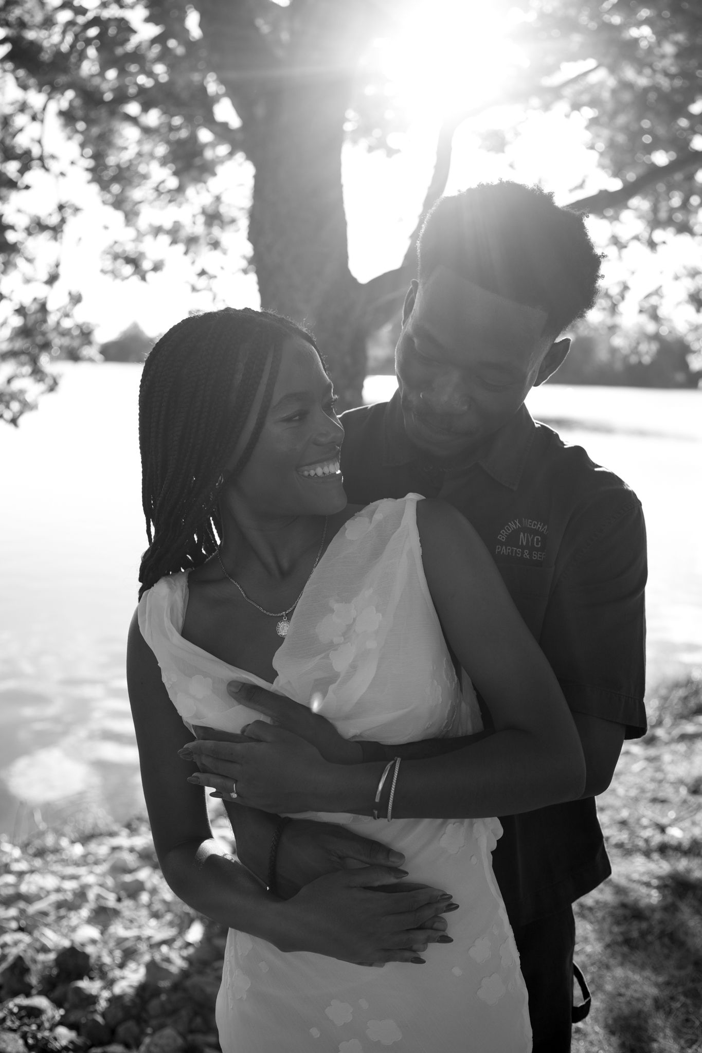 Romantic proposal at a lakeside location in Lexington, Kentucky, with a young Black couple.