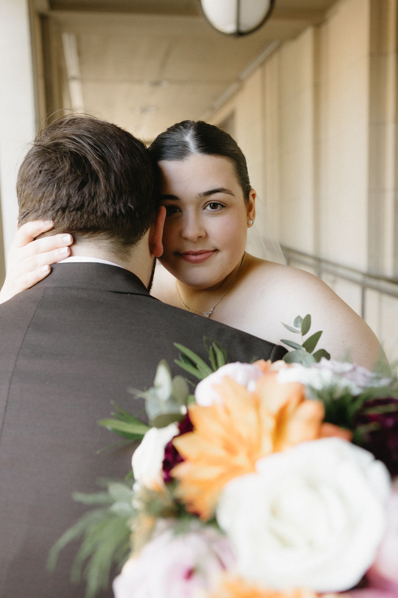 A romantic wedding moment captured in a series of close-up shots with peach and white floral details.
