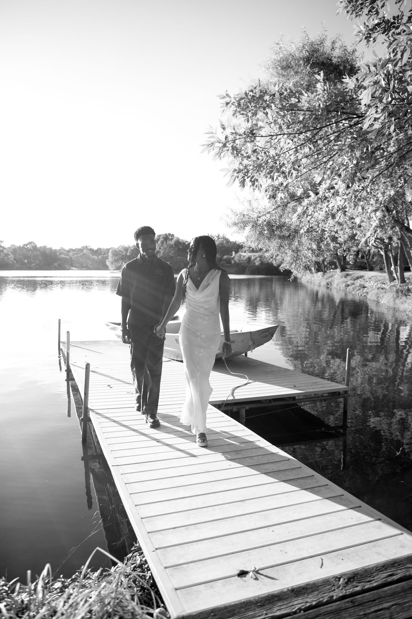 Romantic proposal at a lakeside location in Lexington, Kentucky, with a young Black couple.