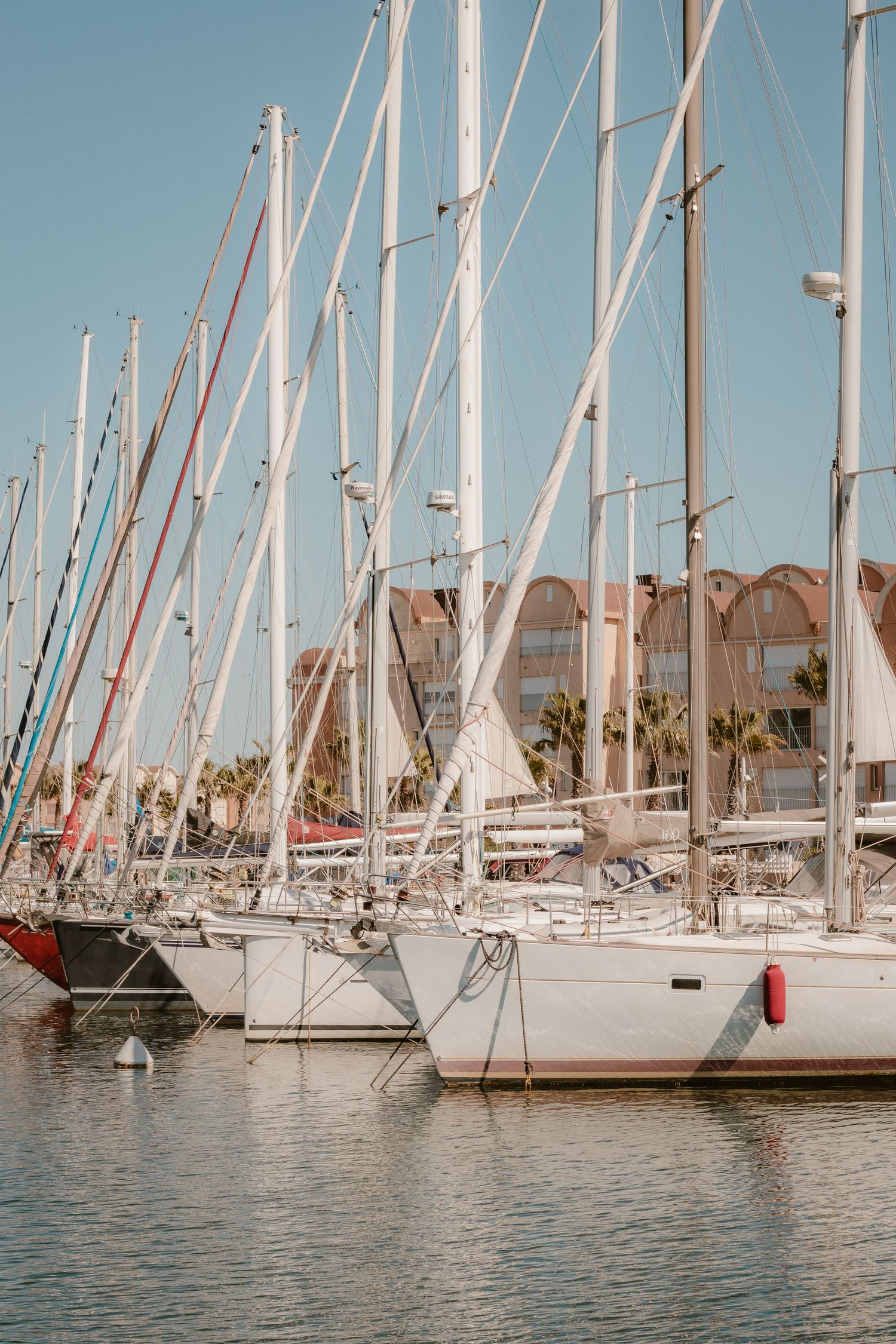 Sailboat cruising along the Mediterranean coast in the South of France