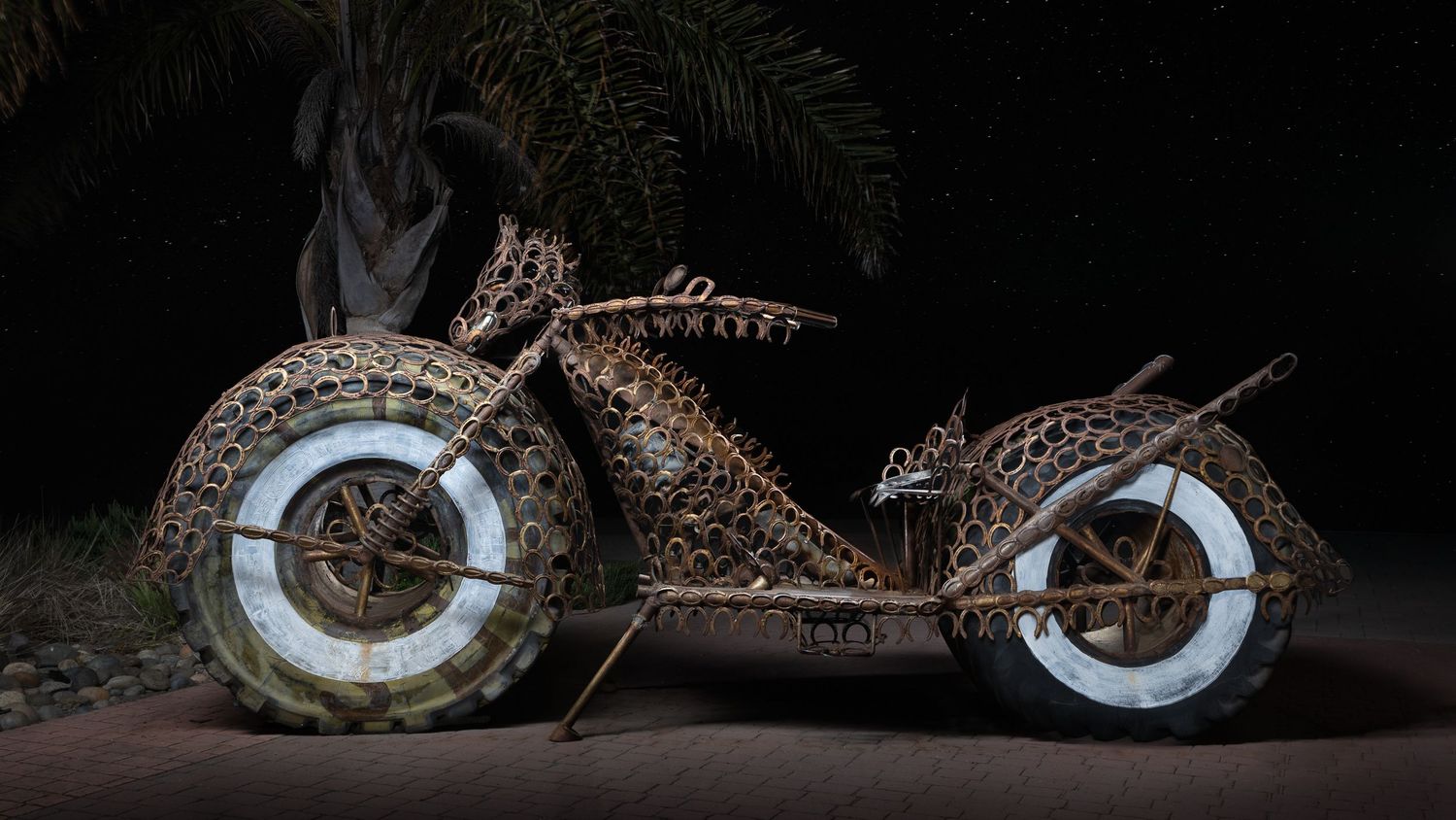 John Gayler Light Painting fine art wall portrait of colossal motor bike sculpture made from horseshoes and tractor tires by Sonny Dalton