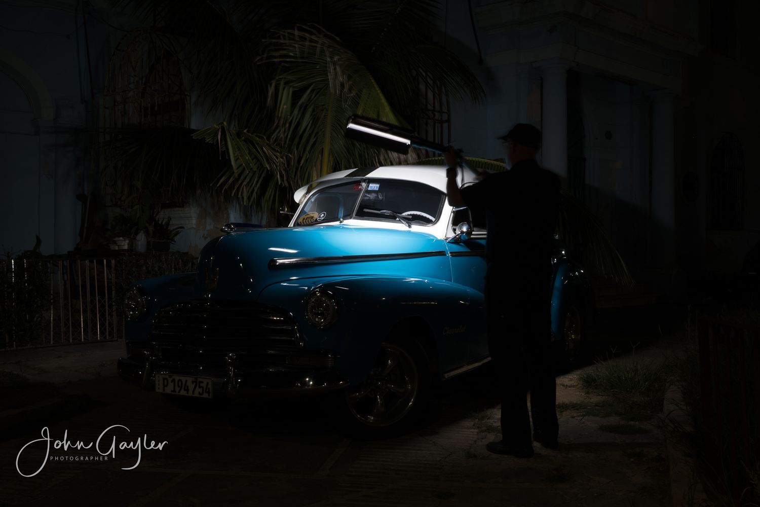 A single frame from a John Gayler light painting of a classic  1946 Chevrolet Fleetmaster highlighting the curves and paint in Old Havana