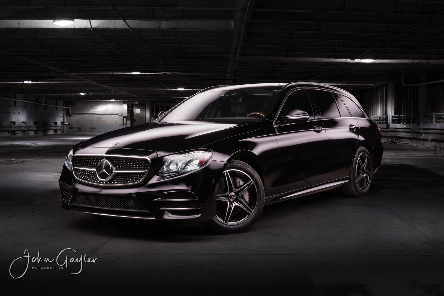 John Gayler light painting fine art wall portrait of 2017 W213 E-Class sports wagon in black trim in a warehouse setting