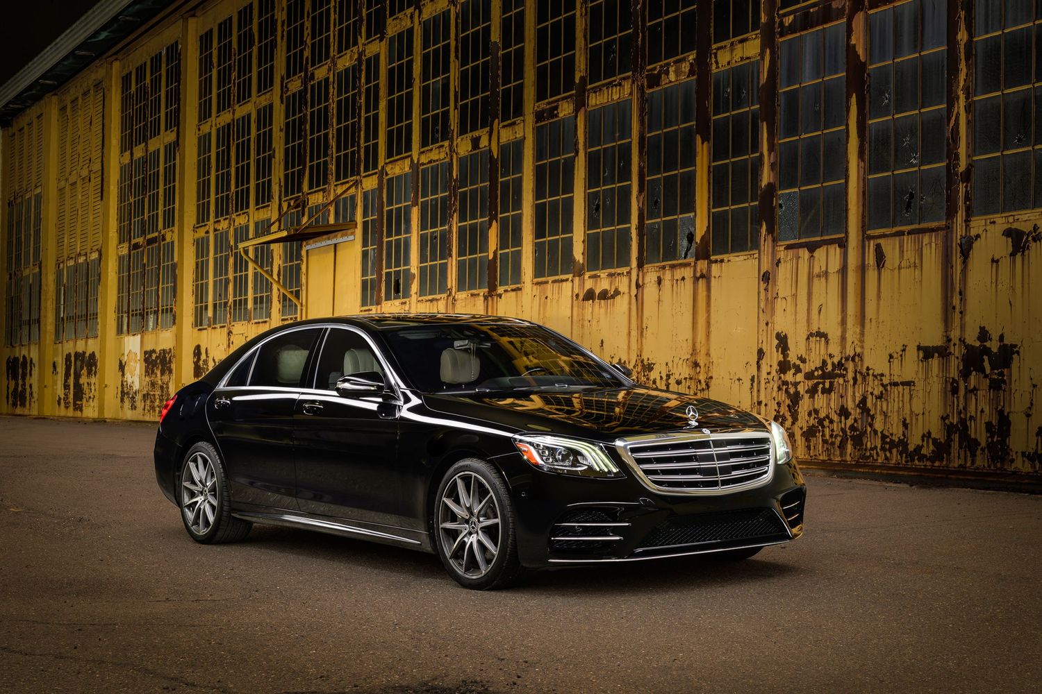 John Gayler Light Painting of a 2019 S560 Limousine in black with white interior outside a disused factory
