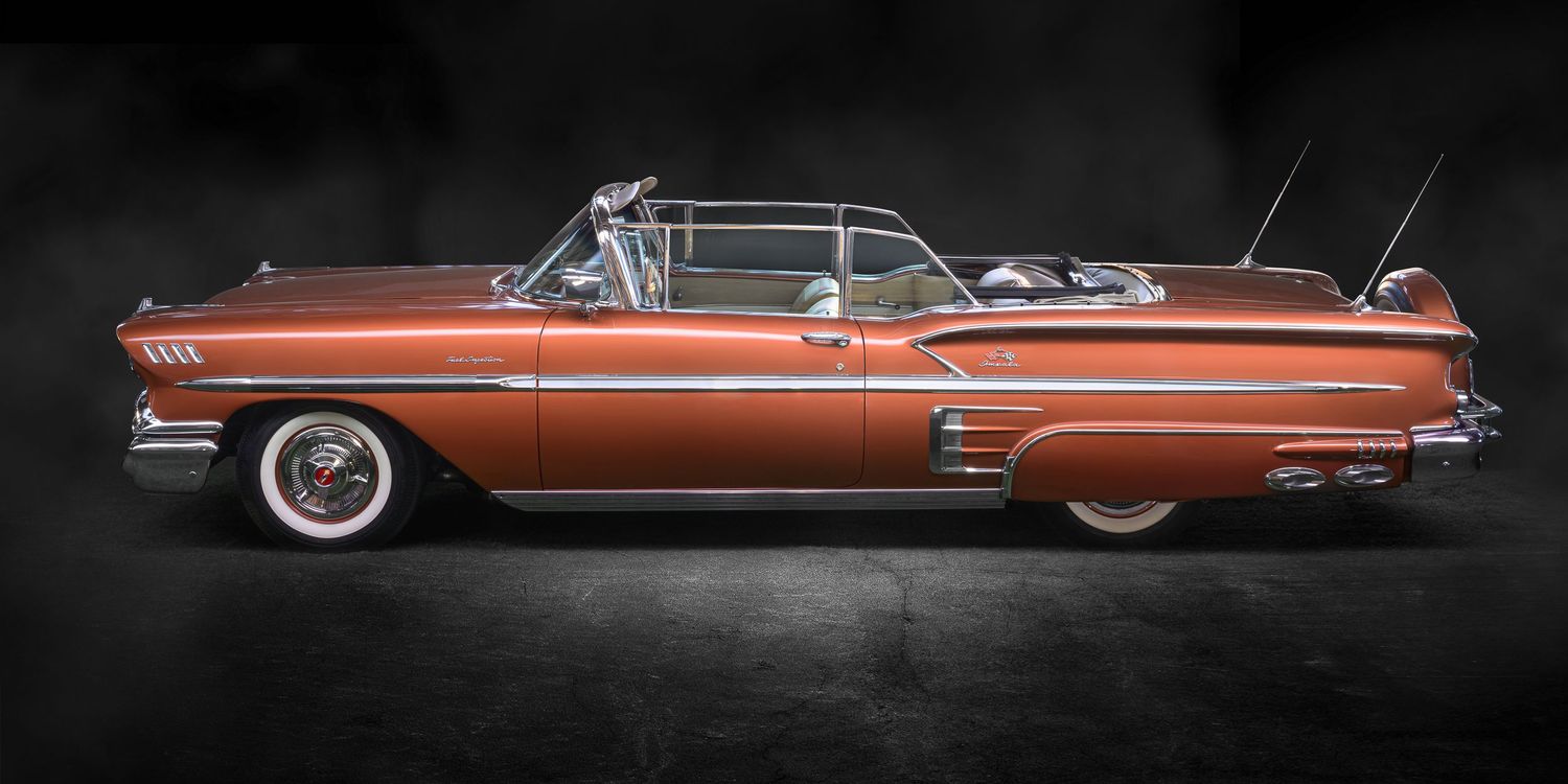 John Gayler Light Painting fine art wall portrait 1958 Chevrolet Impala Convertible Low Rider with luminous copper paint in a studio setting