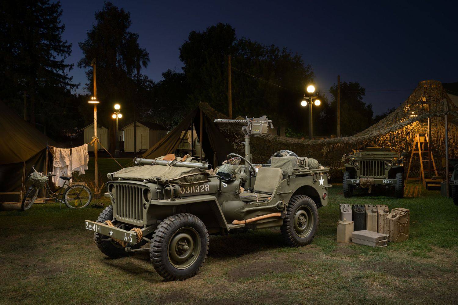 John Gayler Light Painting of a WWII military Ford GPW jeep with M2 machine gun in a nighttime camp scene with tents and period equipment.