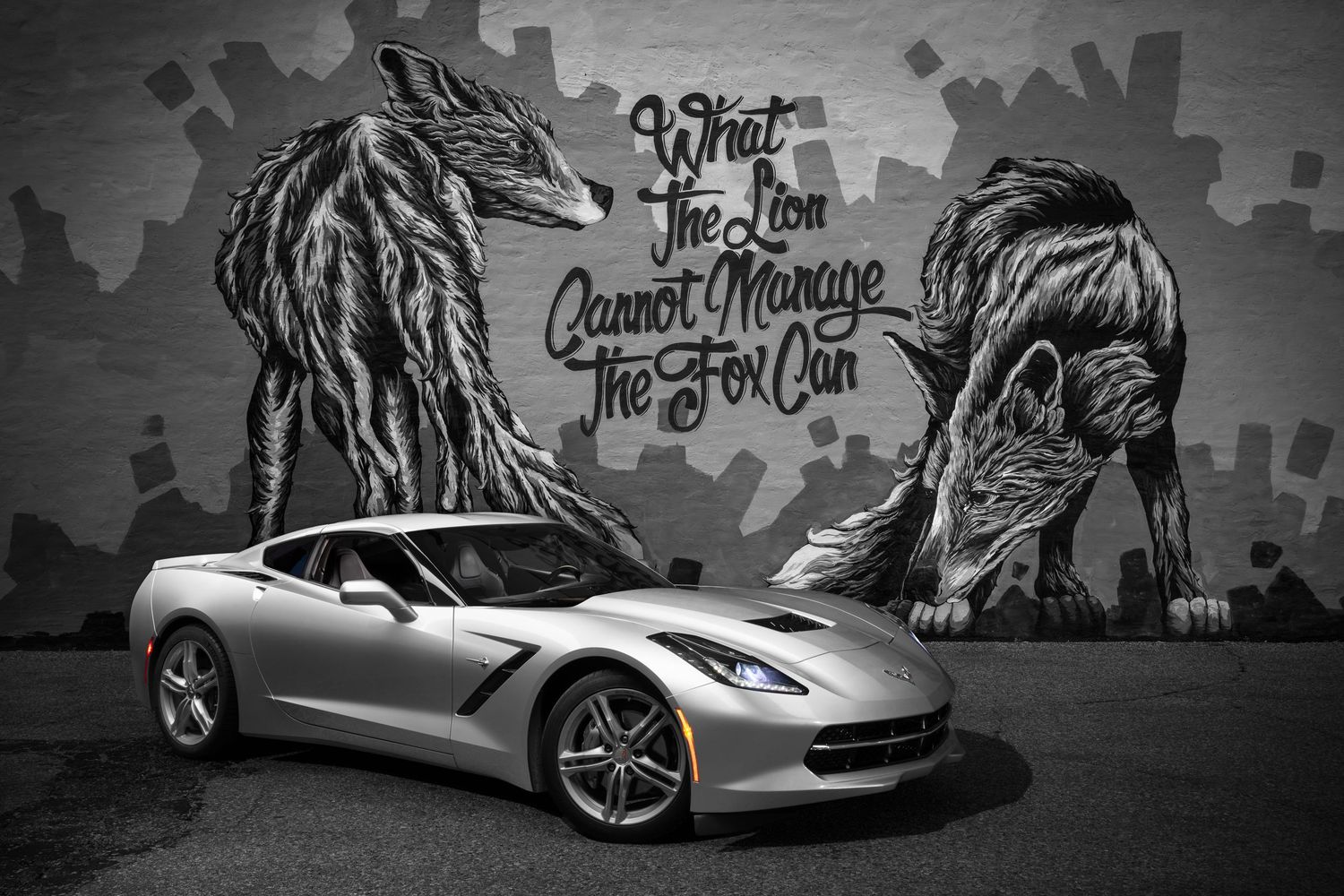 A John Gayler light painted portrait of a silver Chevrolet C7 Corvette with Alexander Landerman's mural in Steven's Point, Wisconsin