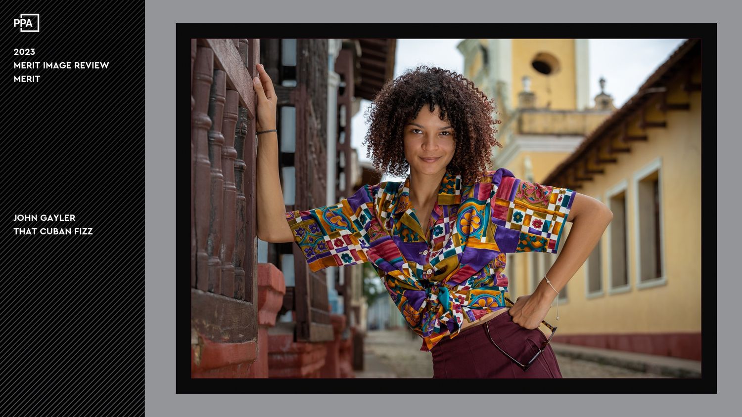 That Cuban Fizz, environmental portrait in Cuba young woman set against rustic architectural backdrop with warm lighting and stone walls.