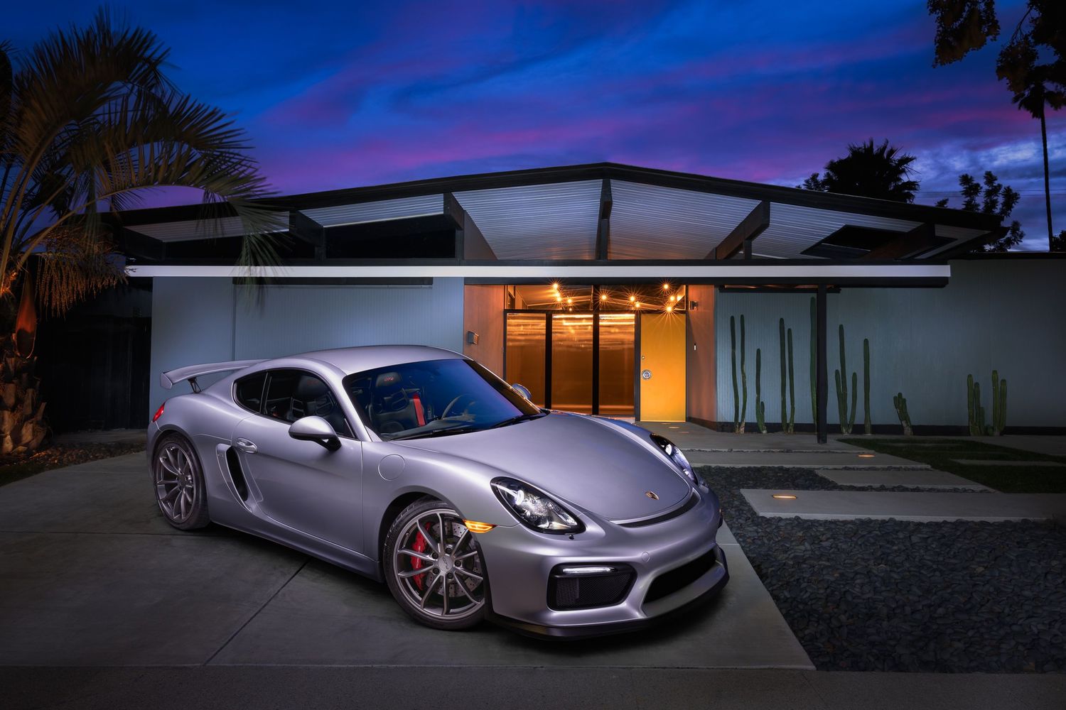 A John Gayler Light painting fine art wall portrait of a Porsche Carrera GT4 outside Eichler house with blue pink sunset sky