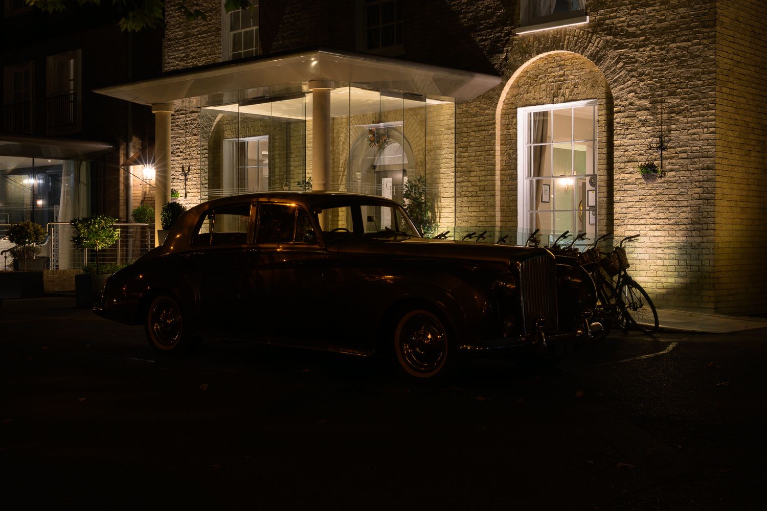 A single frame from a John Gayler light painting of a classic Bentley Limousine background shot at the Gonville Hotel at night