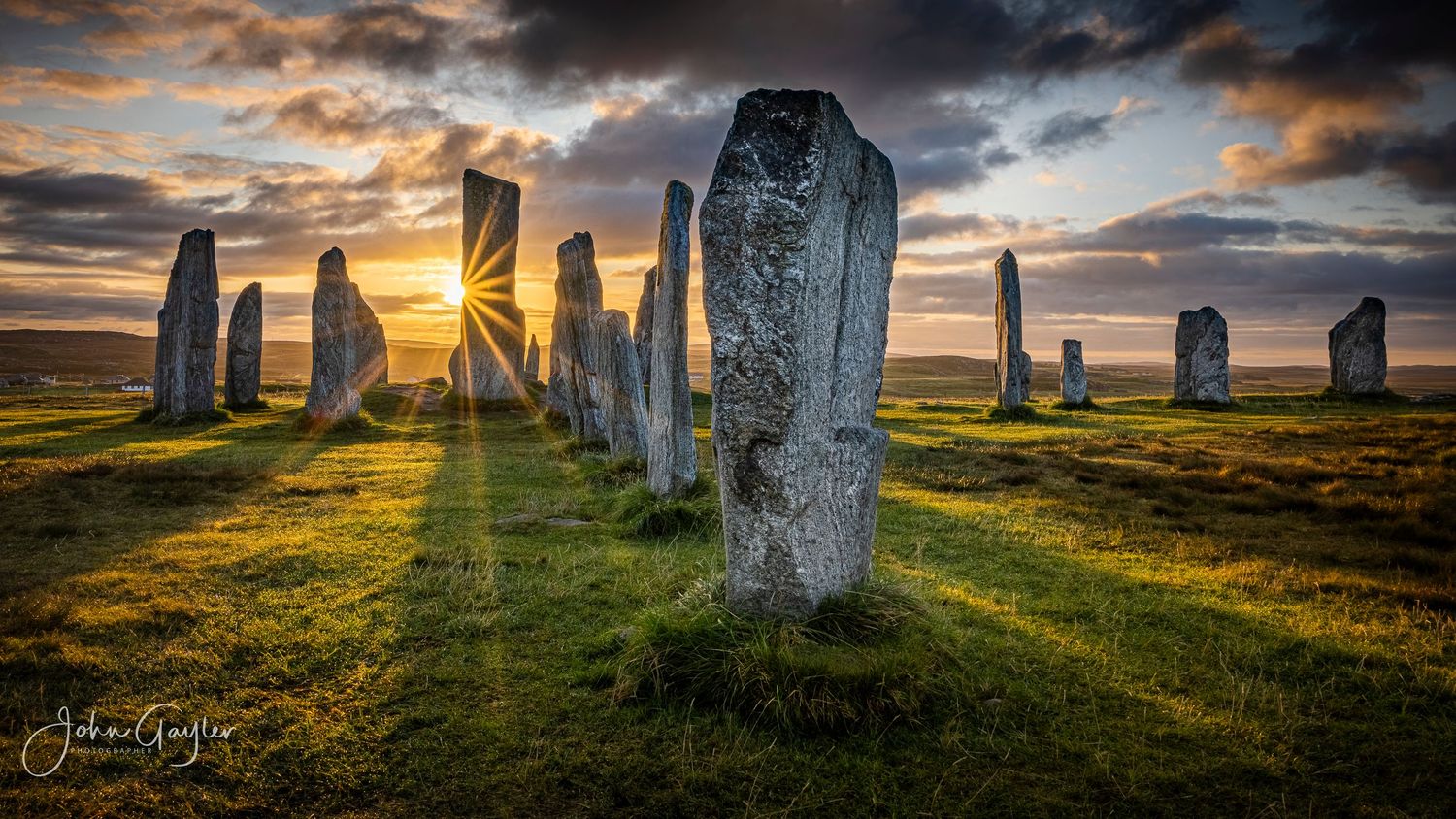 A dramatic sunrise at The Crown, a neolithic stone monument at Callanish on the isle of Lewis in the Outer Hebrides of Scotland