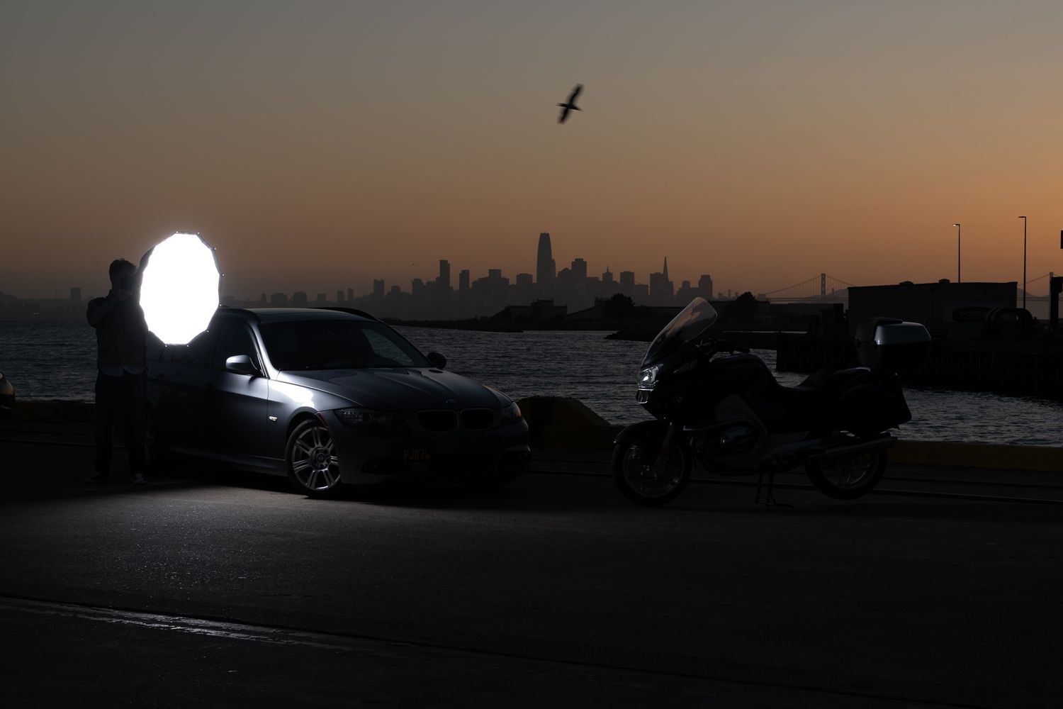 A single frame from a John Gayler light painting series of a BMW 328i sport wagon accentuates details of the bodywork and accessories