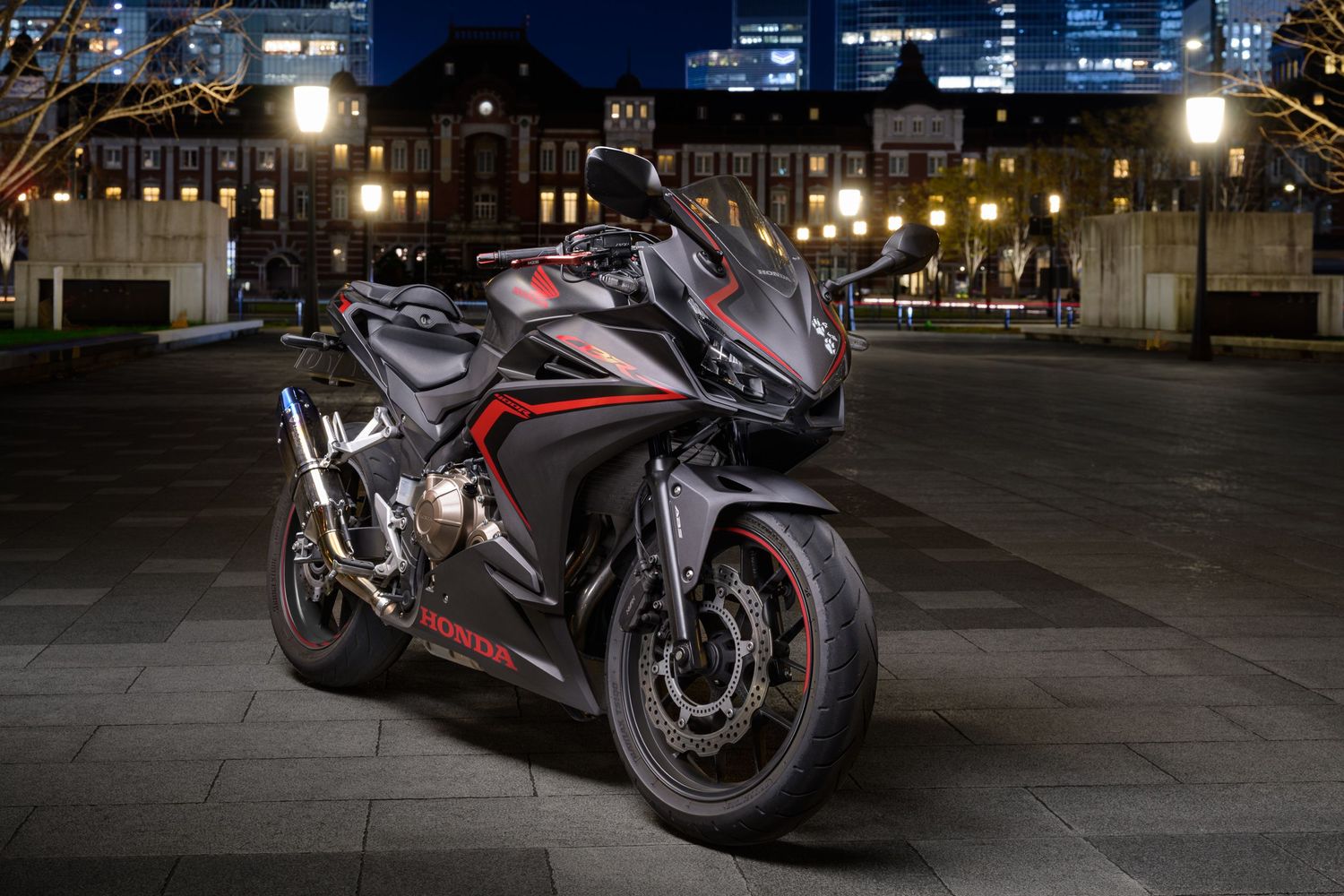 A John Gayler light painted fine art wall portrait of a black and red Honda CBR 400R motorcycle at Tokyo Railway Station