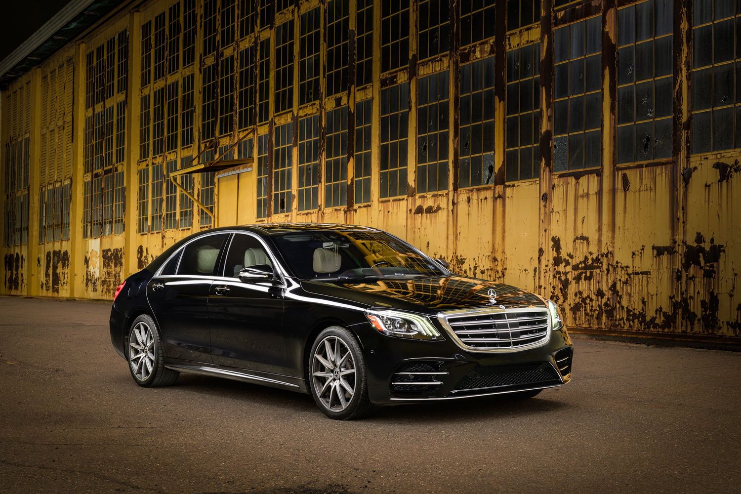 John Gayler Light Painting of a 2019 Mercedes S560 luxury sedan in gloss black with AMG wheels at a disused factory at Alameda Naval Base