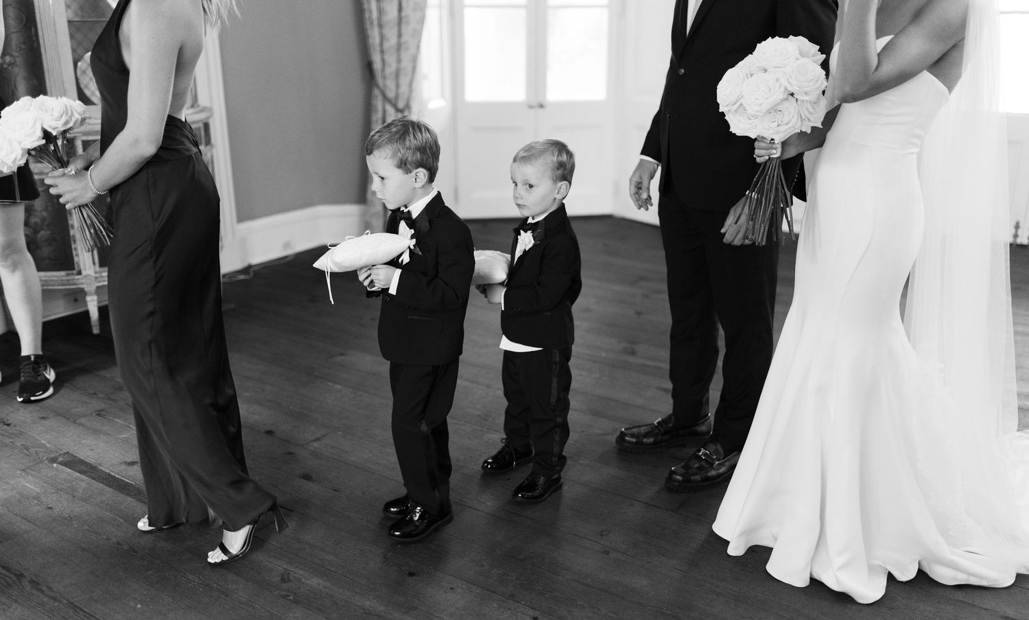 Black and white candid shots of wedding guests dancing at a reception.