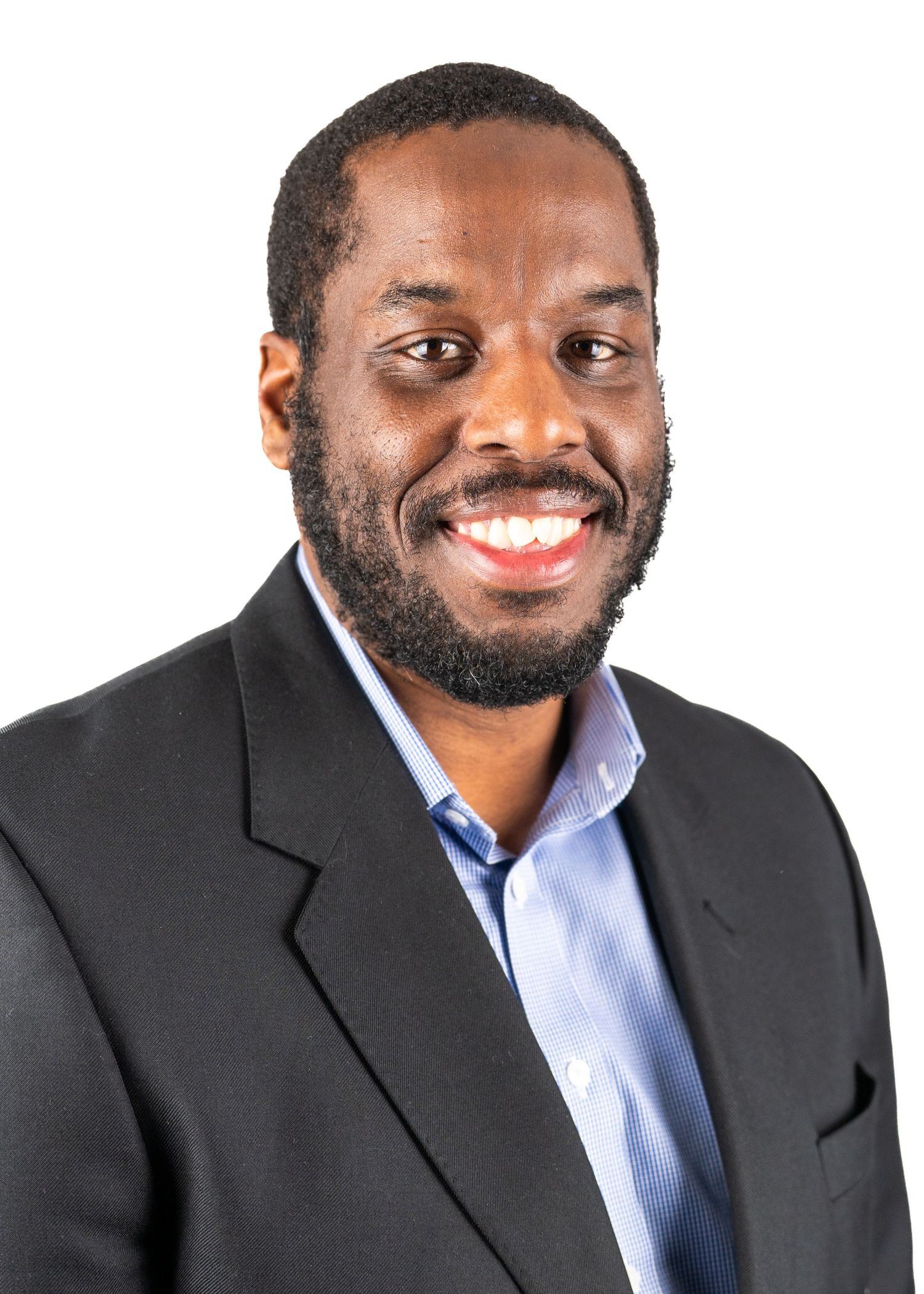 Professional headshots showing warm expressions in dark suit and blue shirt.