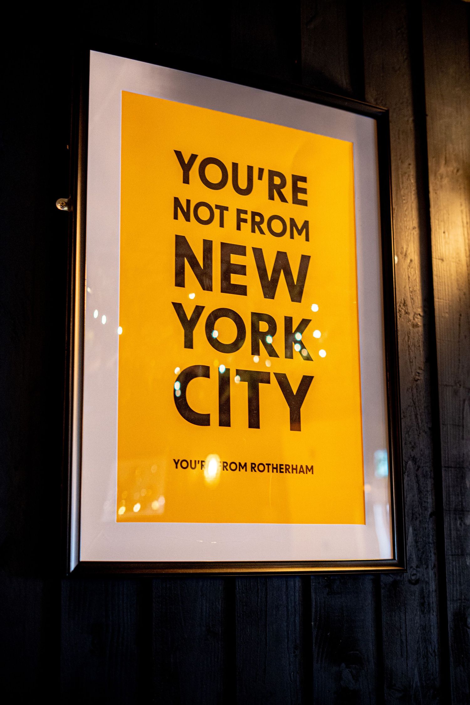 Yellow and black typography art prints displaying New York City themed messages.