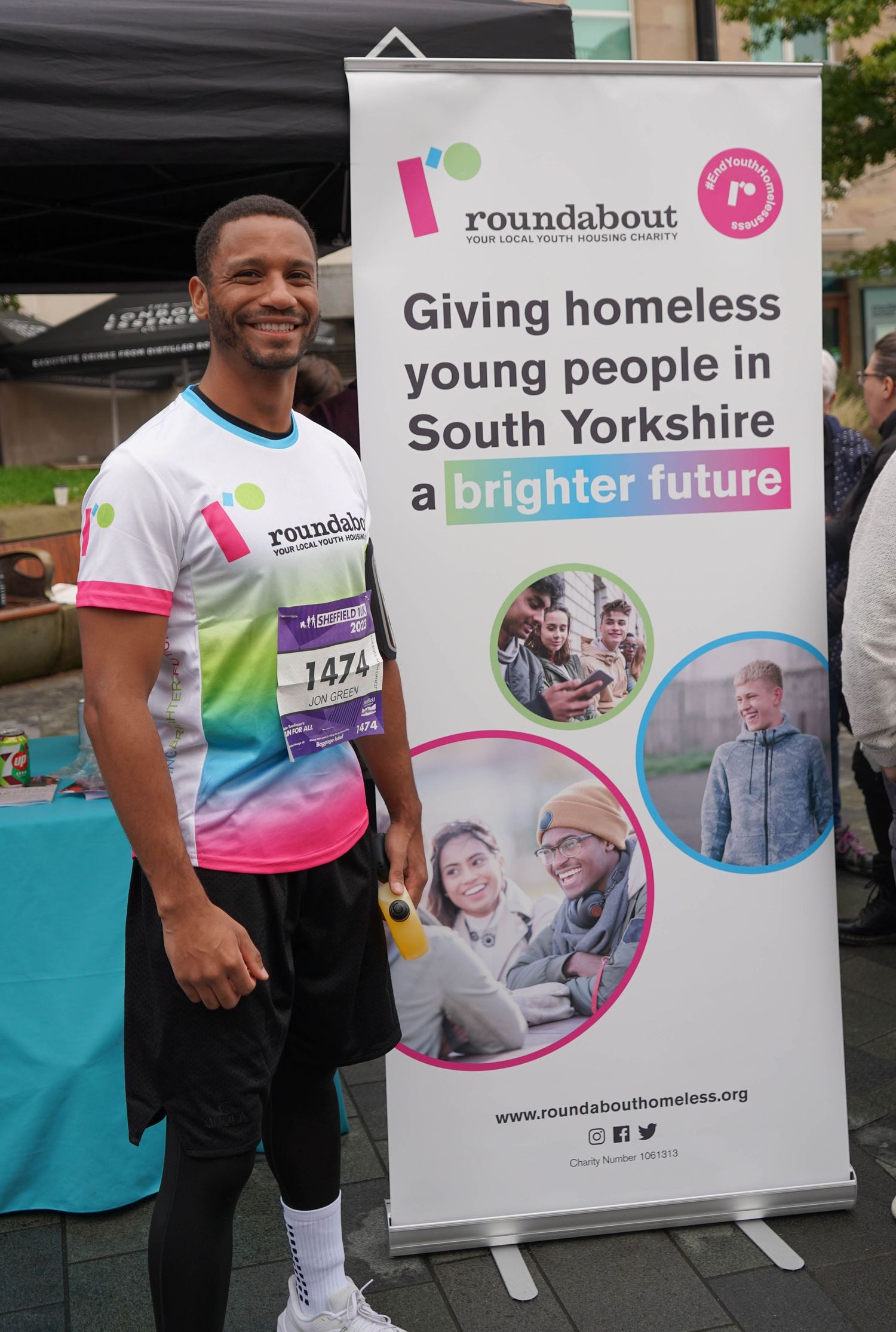 Roundabout charity banners and signage displayed at an outdoor fundraising event.