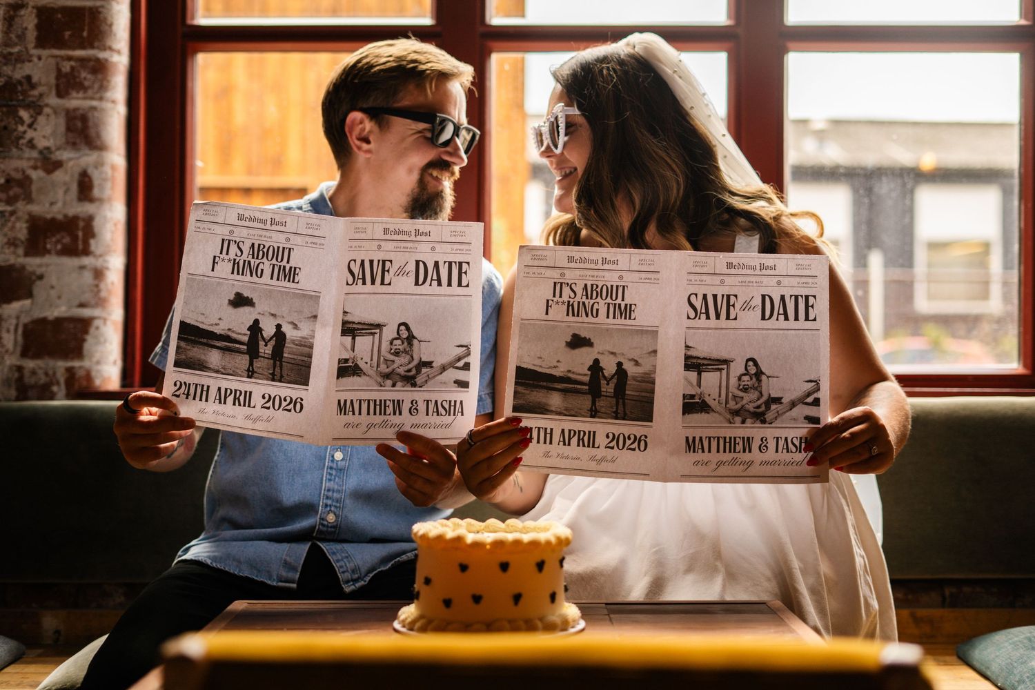 Save the date announcement photo session in an industrial-style venue.