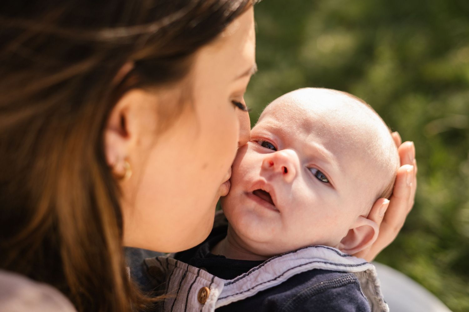 Intimate family portrait series captured in warm natural sunlight.