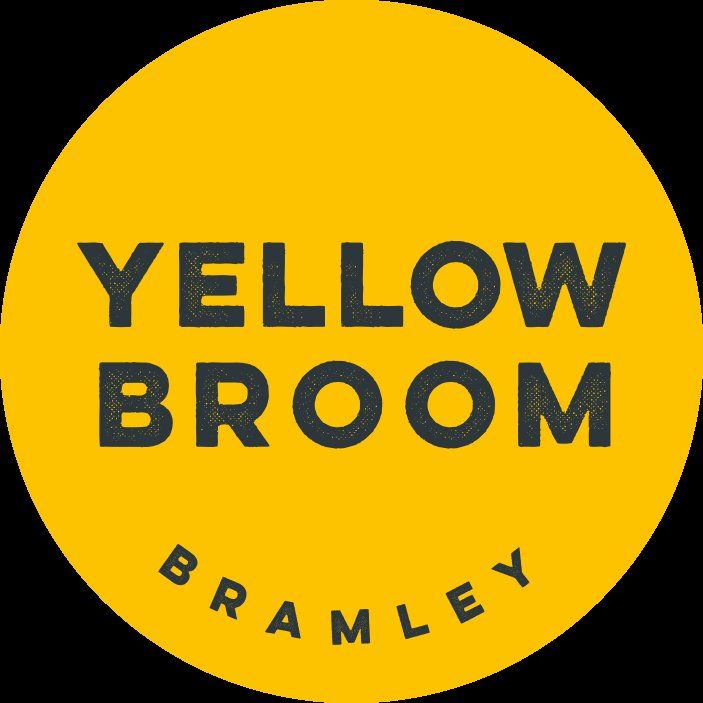 Yellow circular logo design for Yellow Broom Bramley against black background.