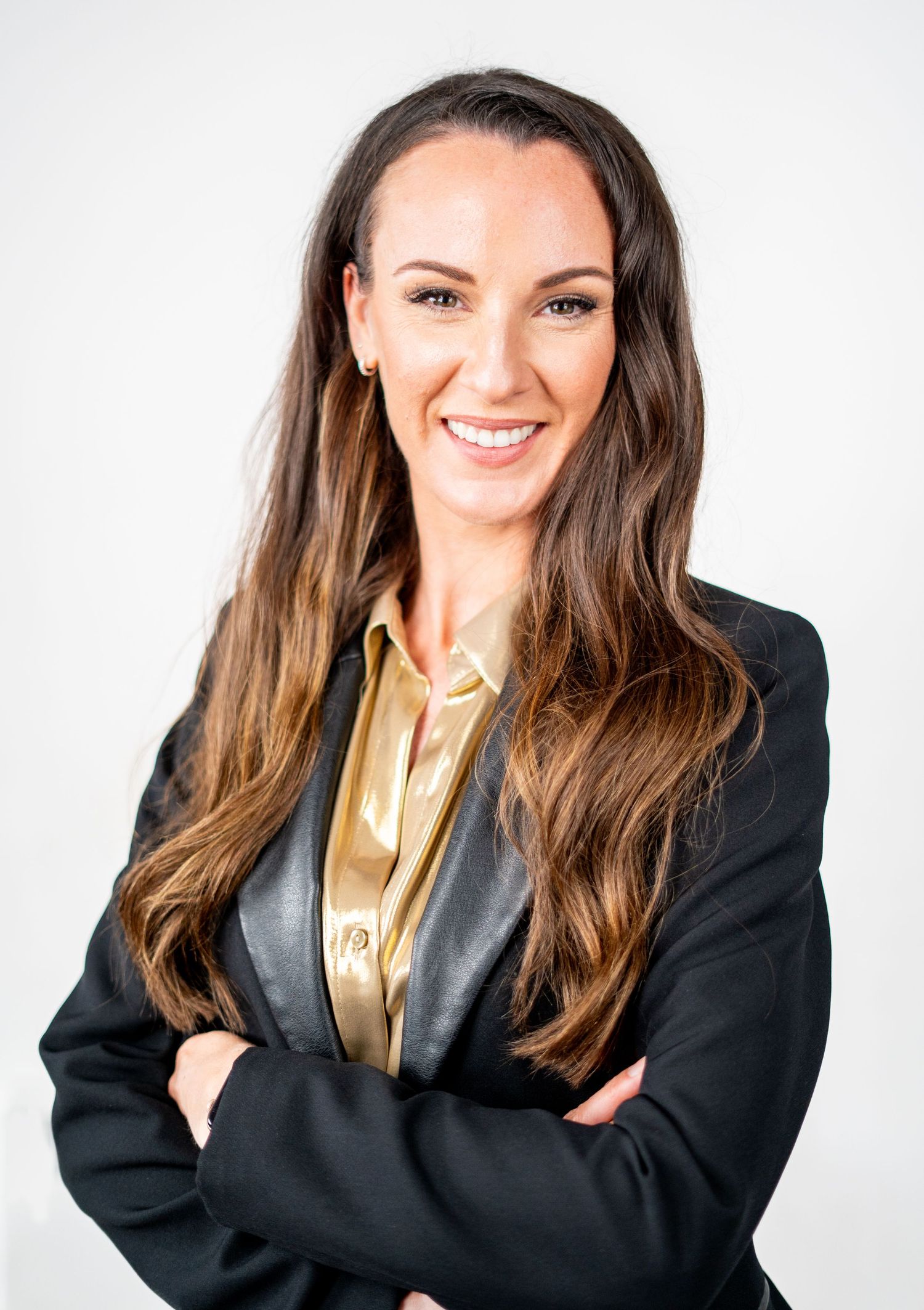Professional portrait in business attire against white background.