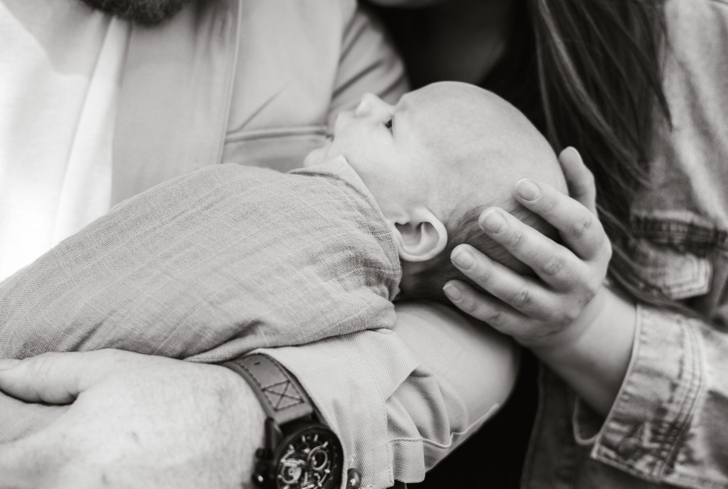 Intimate black and white family portraits showing tender moments.