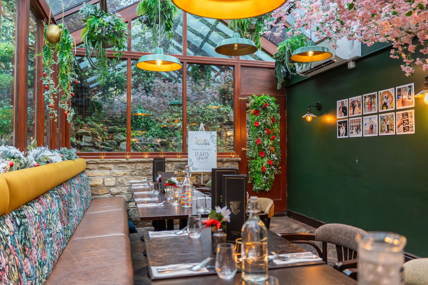 Cozy dining room with stone walls and floral decorations.