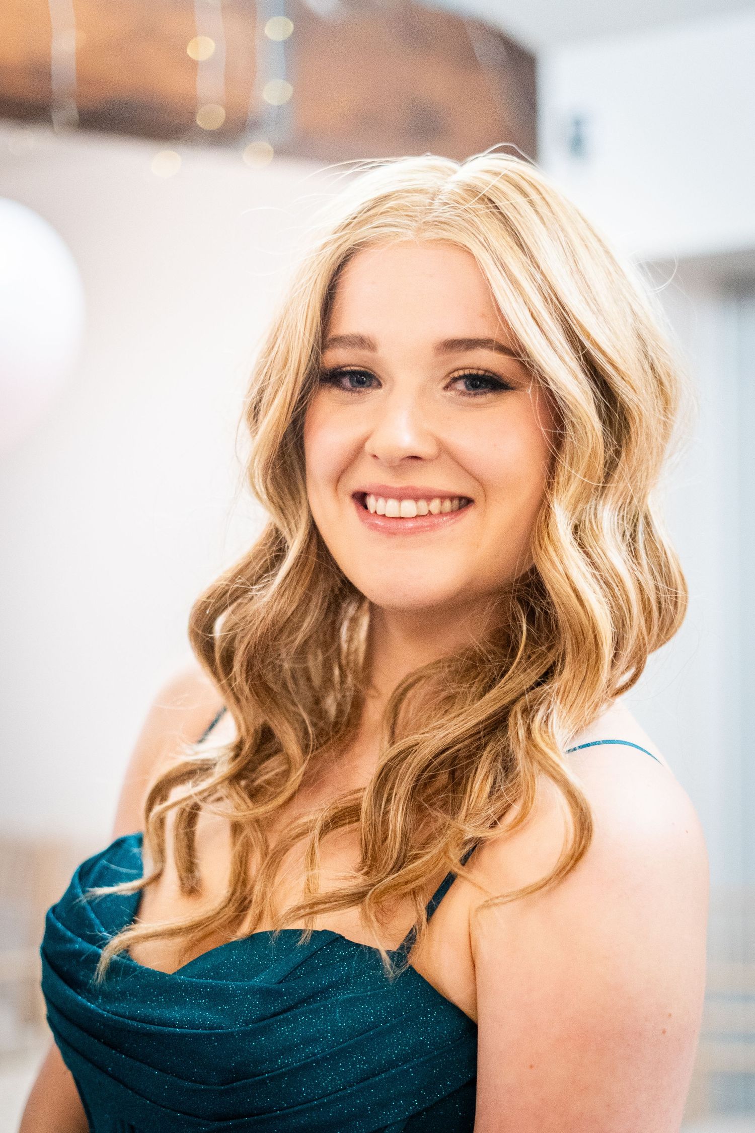 Close-up portrait shots showing warm expressions and wavy blonde hair against a light background.