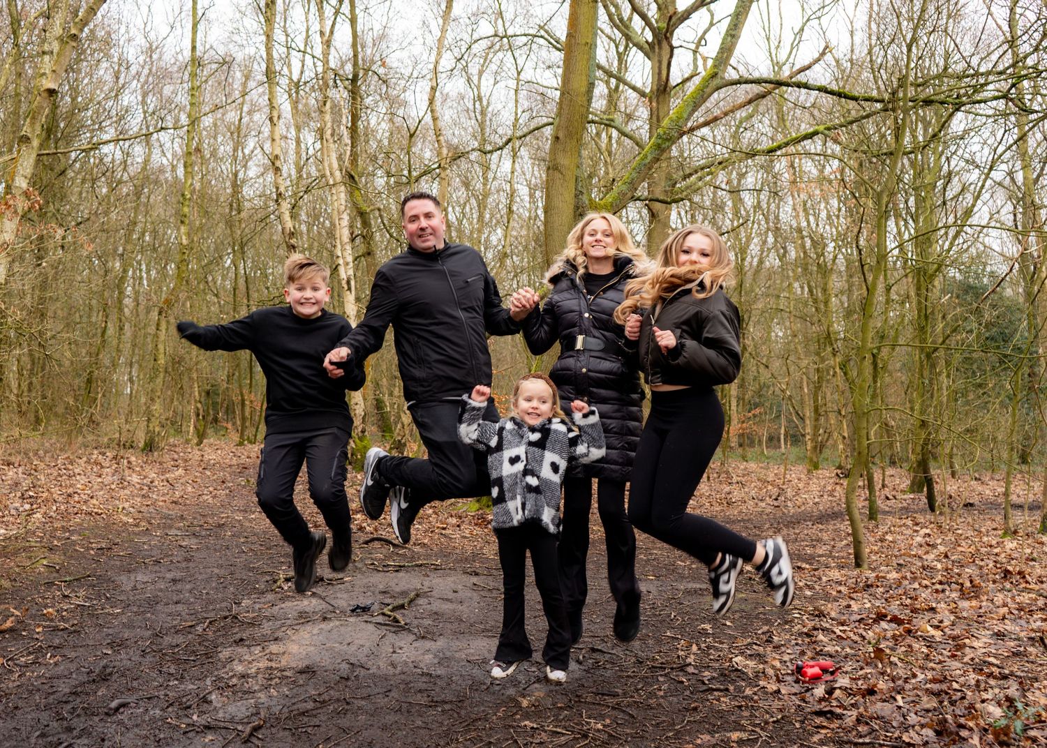 Dynamic action shots of people jumping and playing in a winter forest setting.