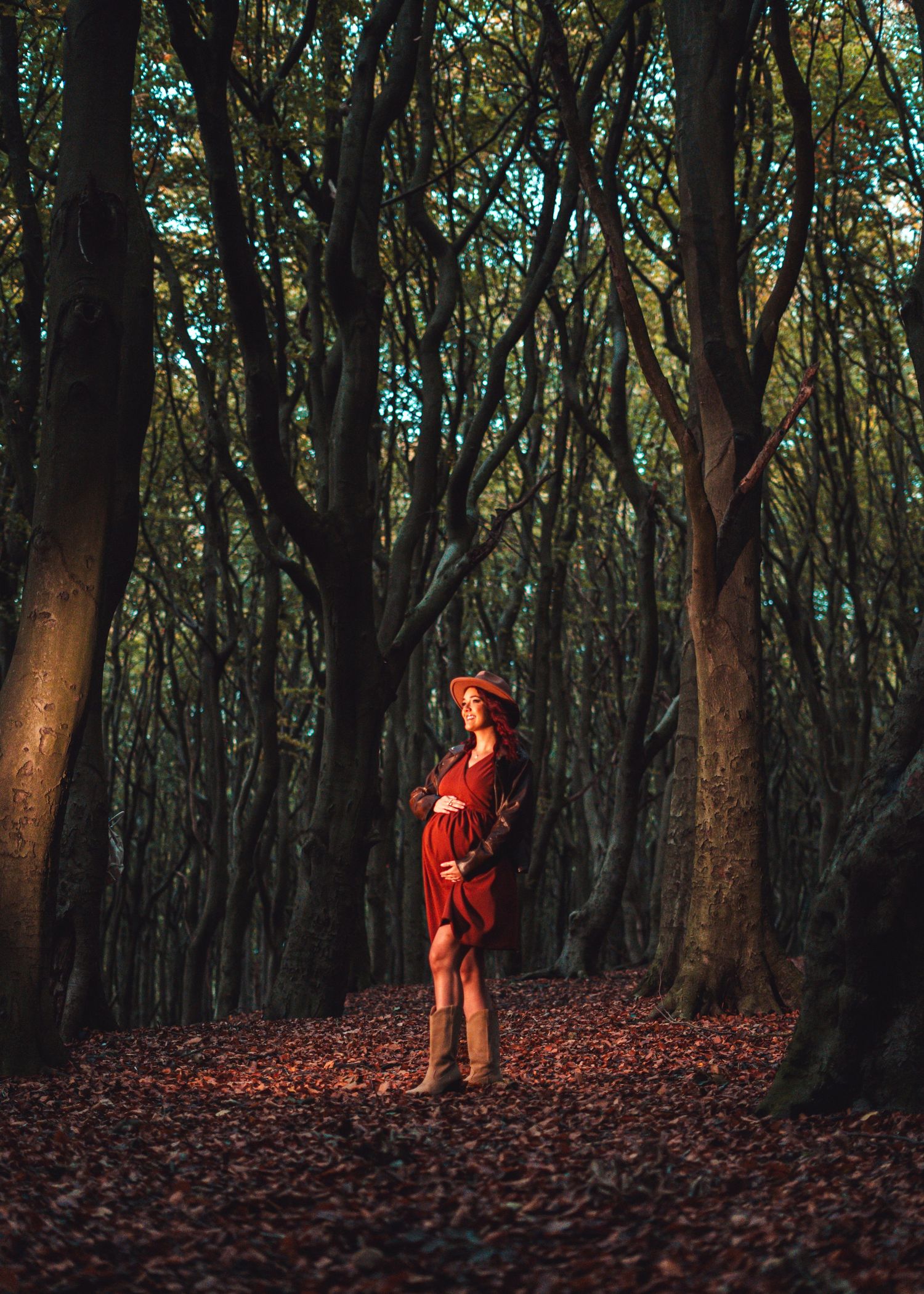 Woodland photography sequence showing a person in red walking through a forest of bare trees.
