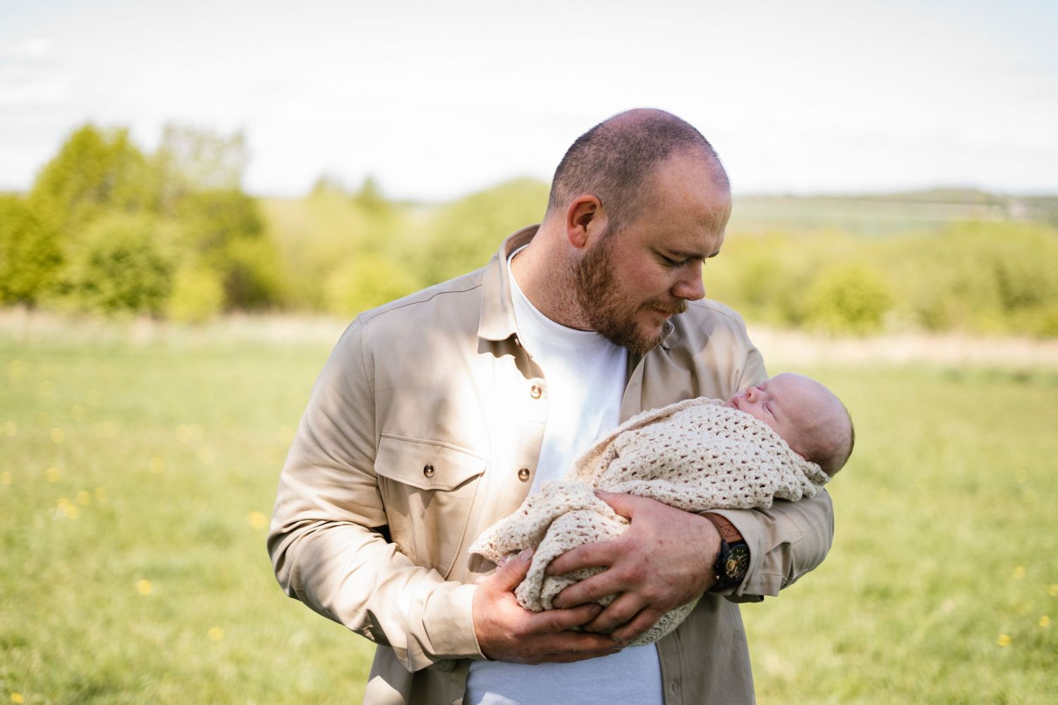 A series of tender moments captured as someone cradles something small in their hands.