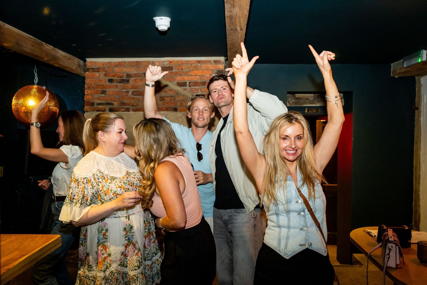 People dancing and celebrating at a nighttime social event.