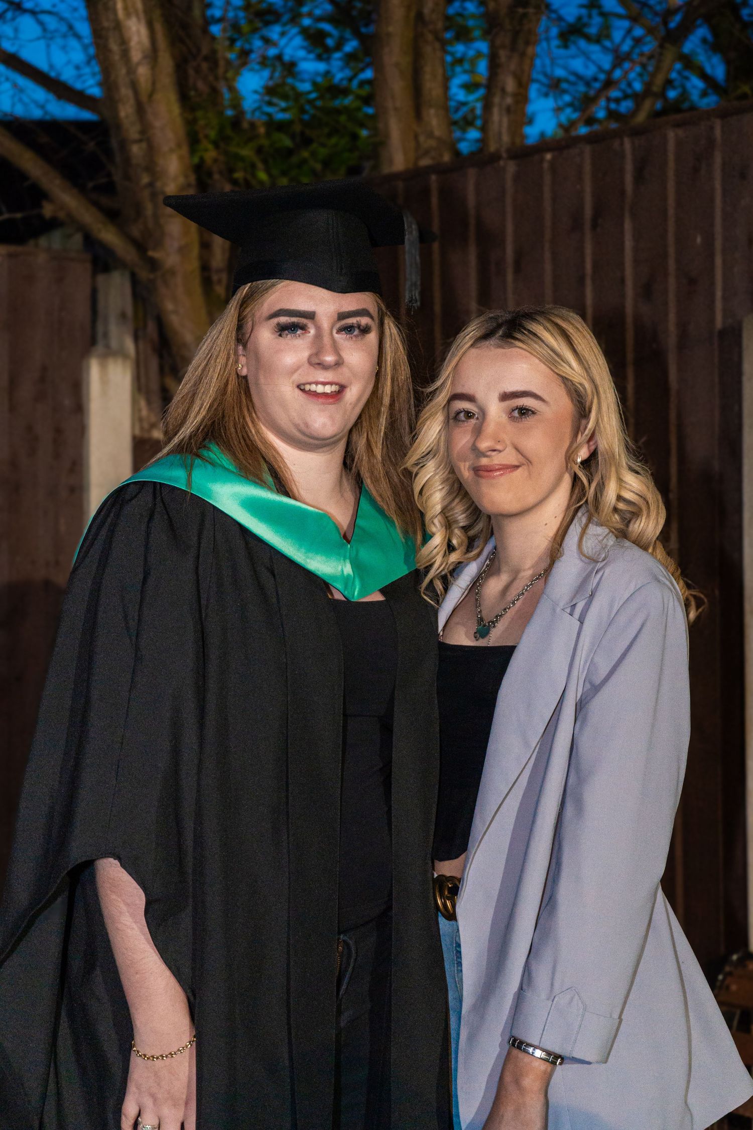 Graduation portraits featuring academic regalia and casual poses in an outdoor setting.