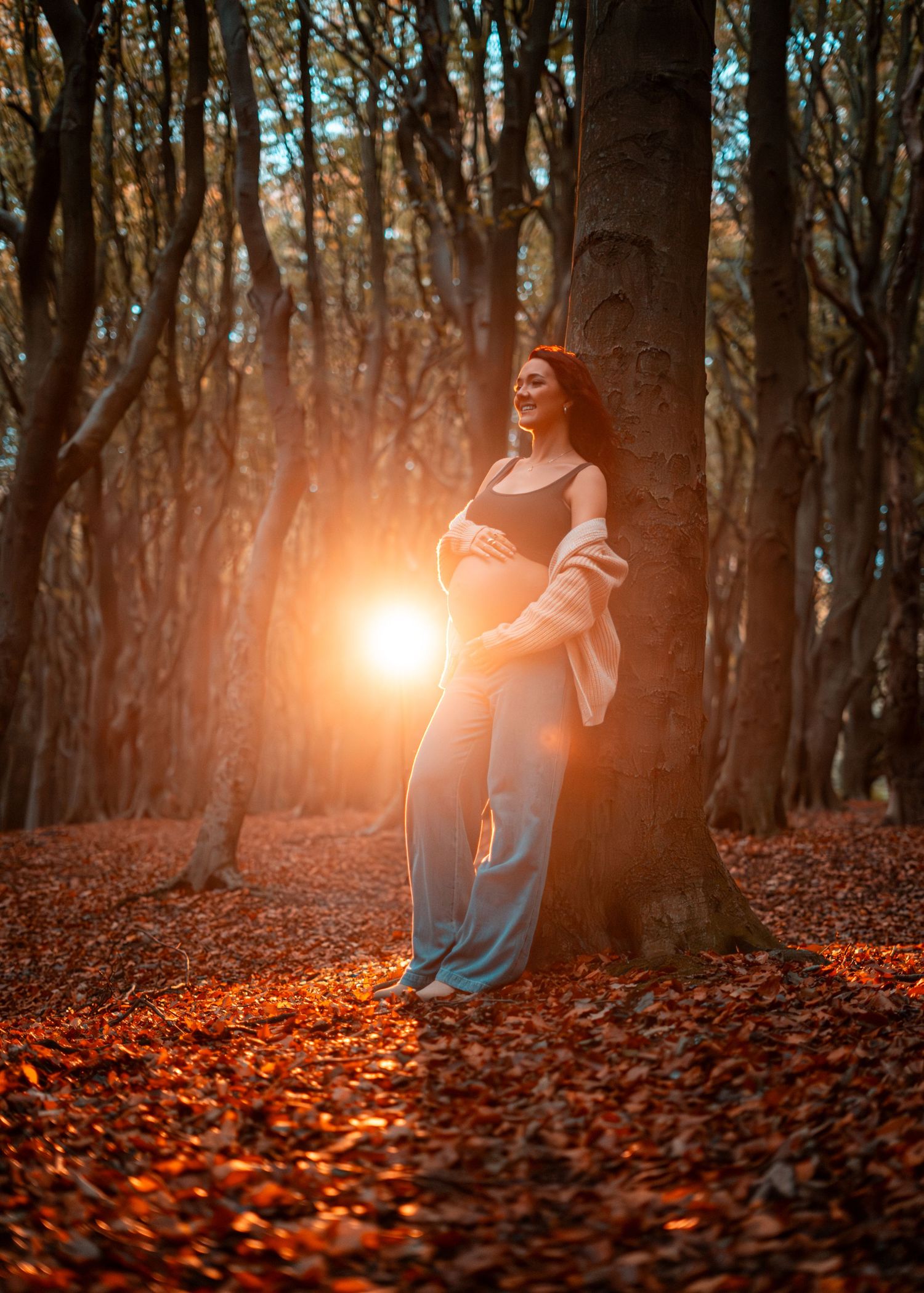 Artistic photos of a figure in a forest with golden sunlight and autumn leaves.