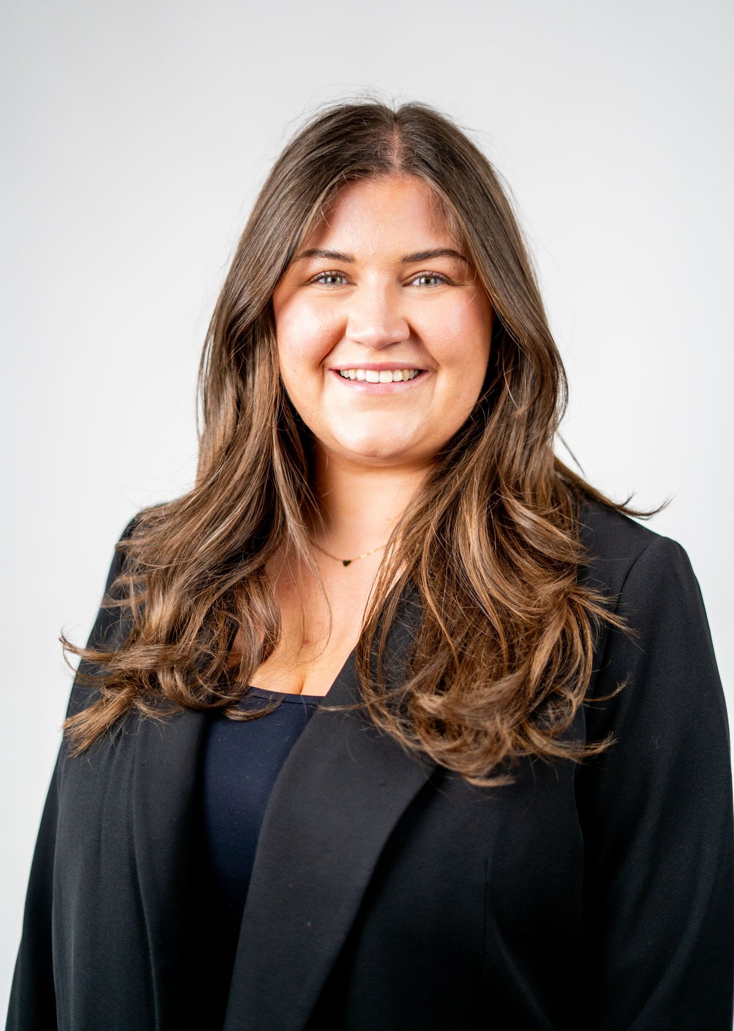 Business portrait series showing confident poses against white background.