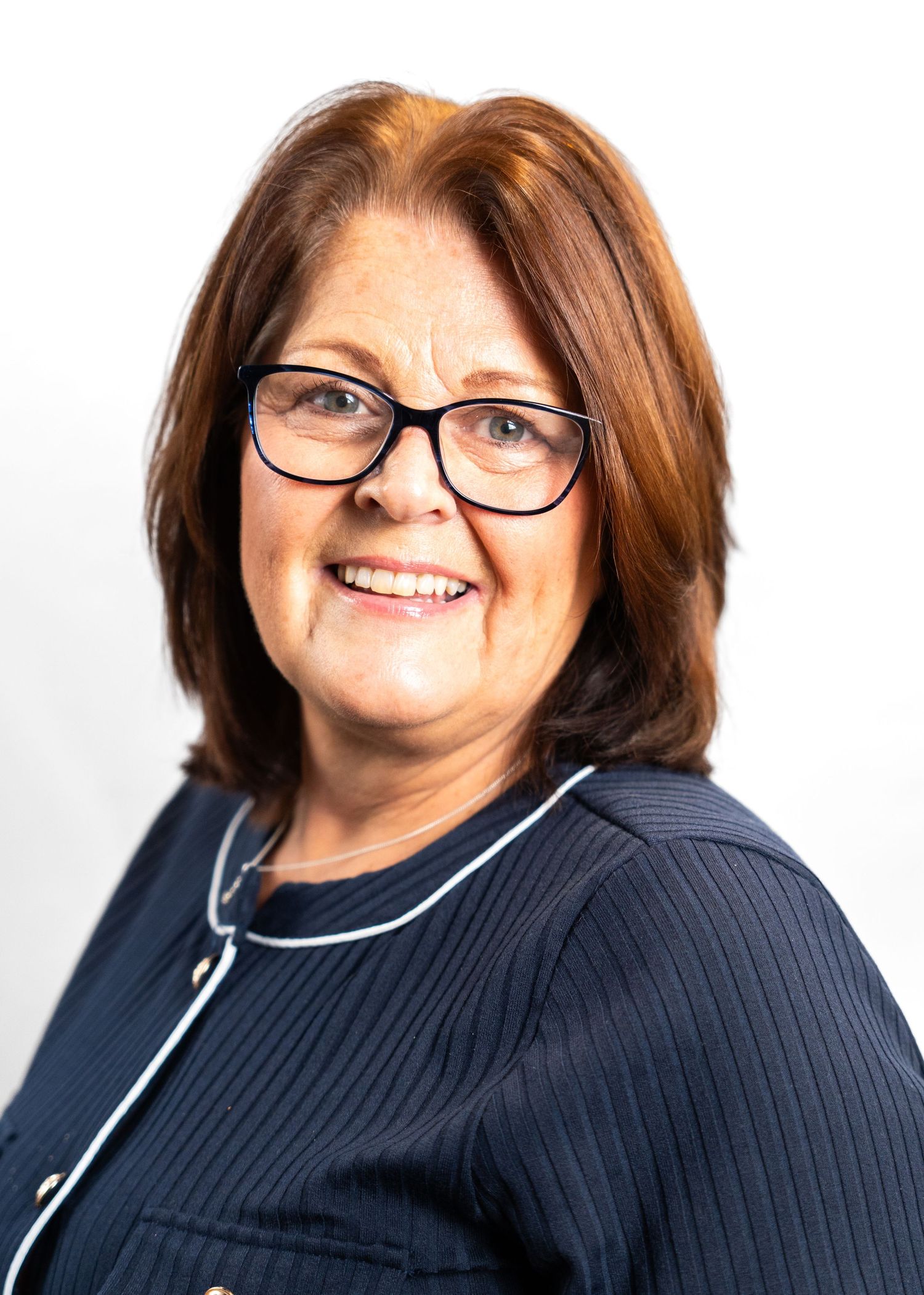 Professional portrait series showing warm expressions in navy sweater.