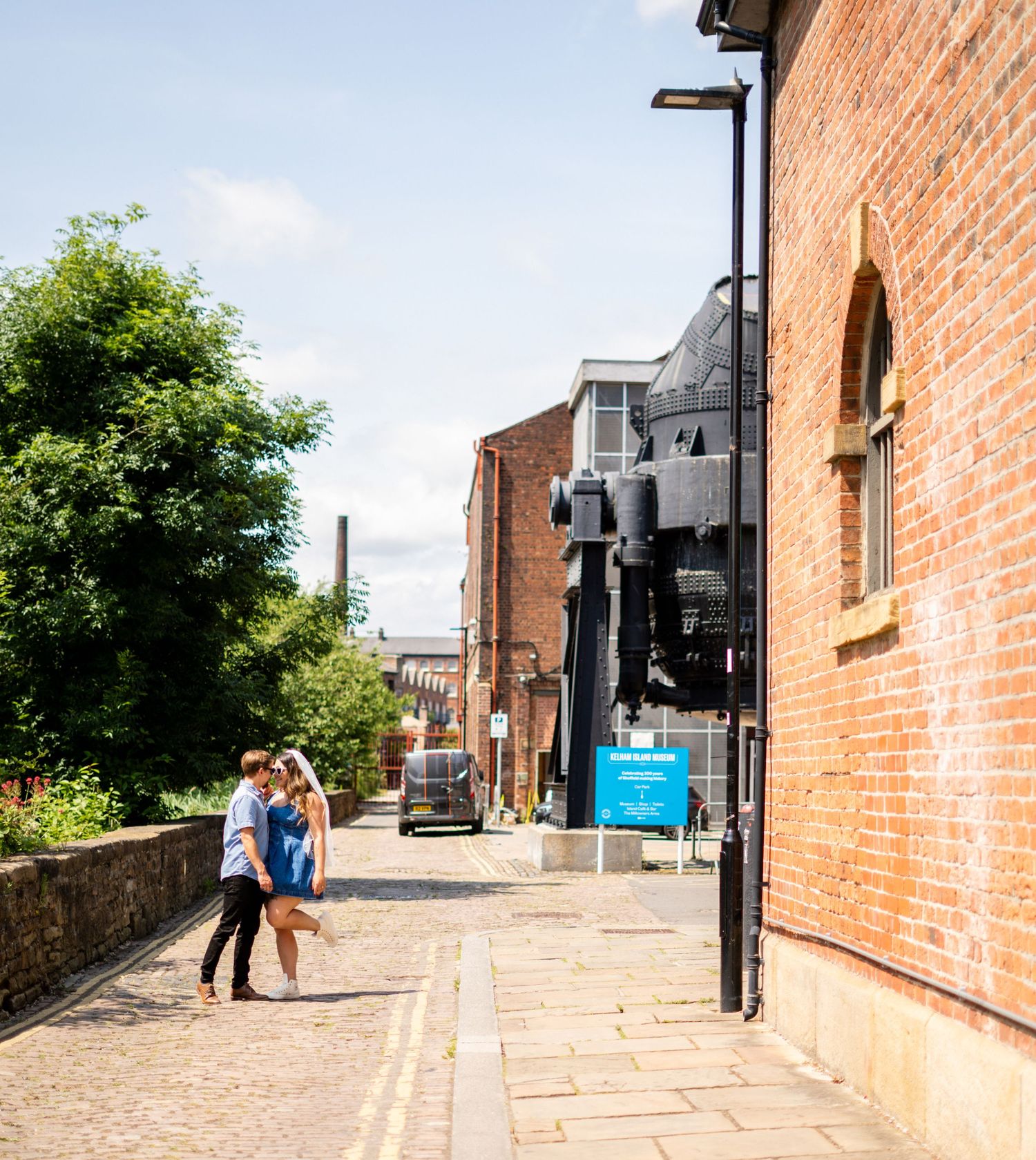 Urban street photography along brick buildings with cobblestone pathways.