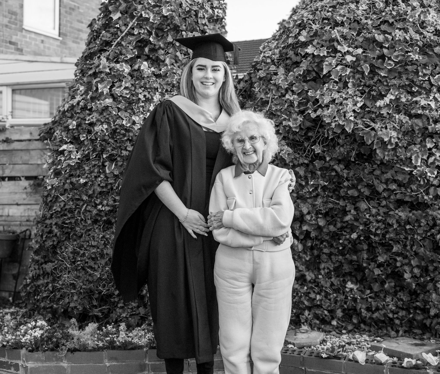 Graduation photos showing heartwarming moments between graduate and elderly relative outdoors.