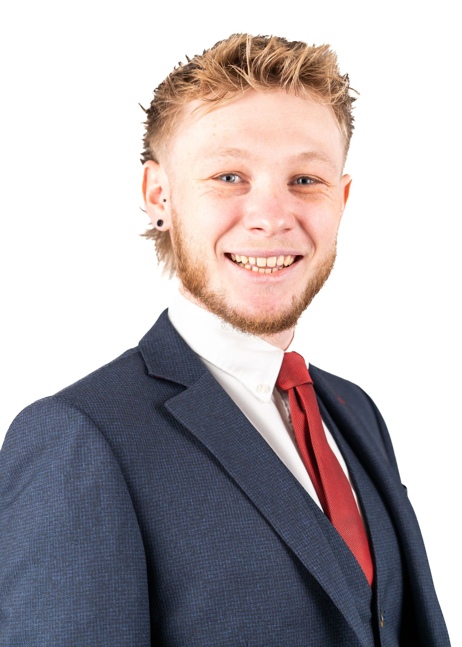 Professional headshots showing different poses in navy suit and red tie.