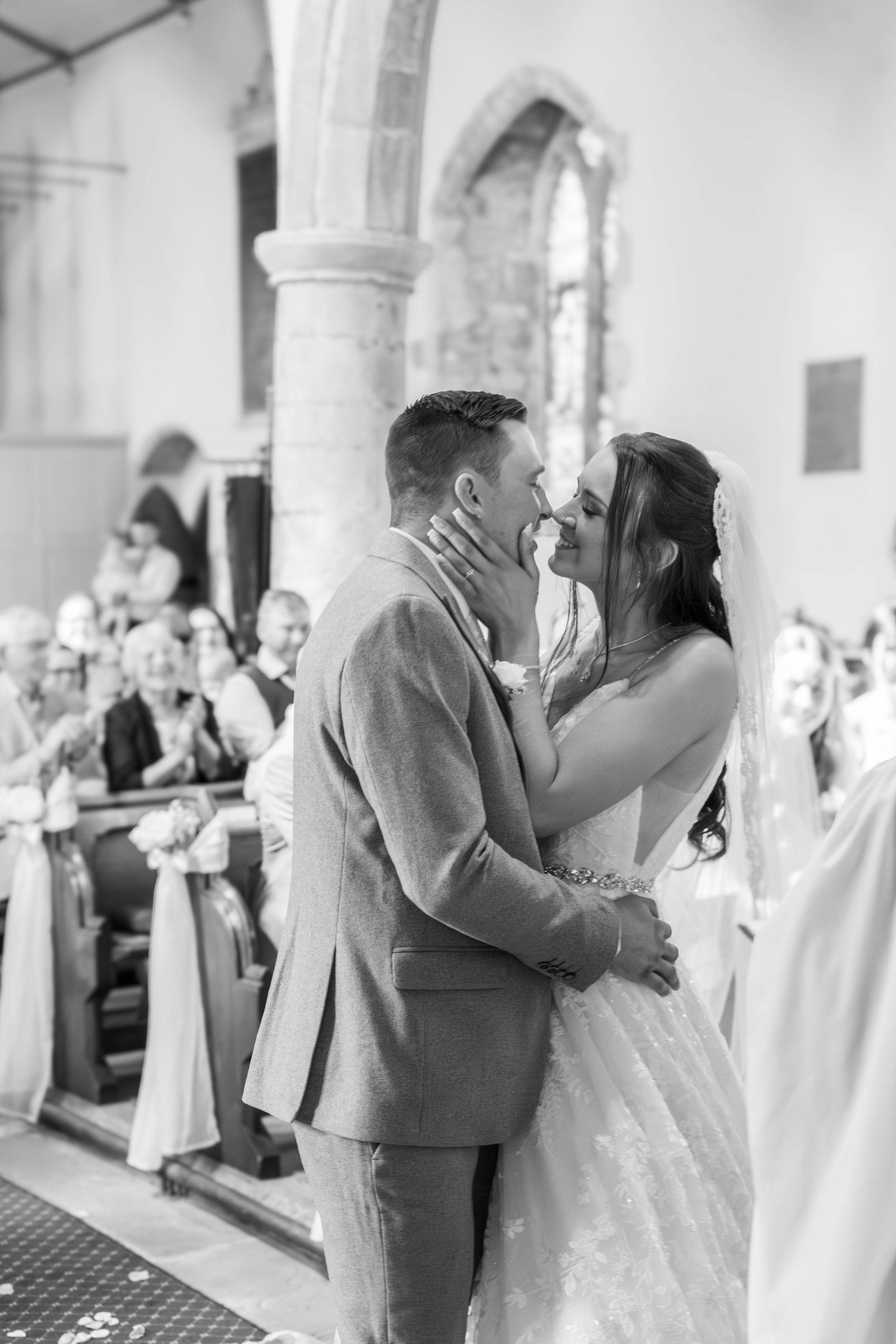 Wedding celebration sequence showing romantic moments in a church colonnade.