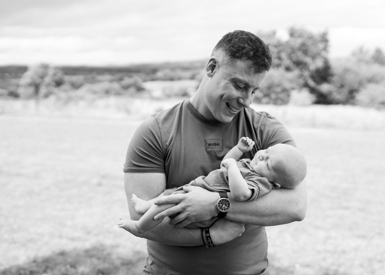 Black and white portrait of tender moment with infant.
