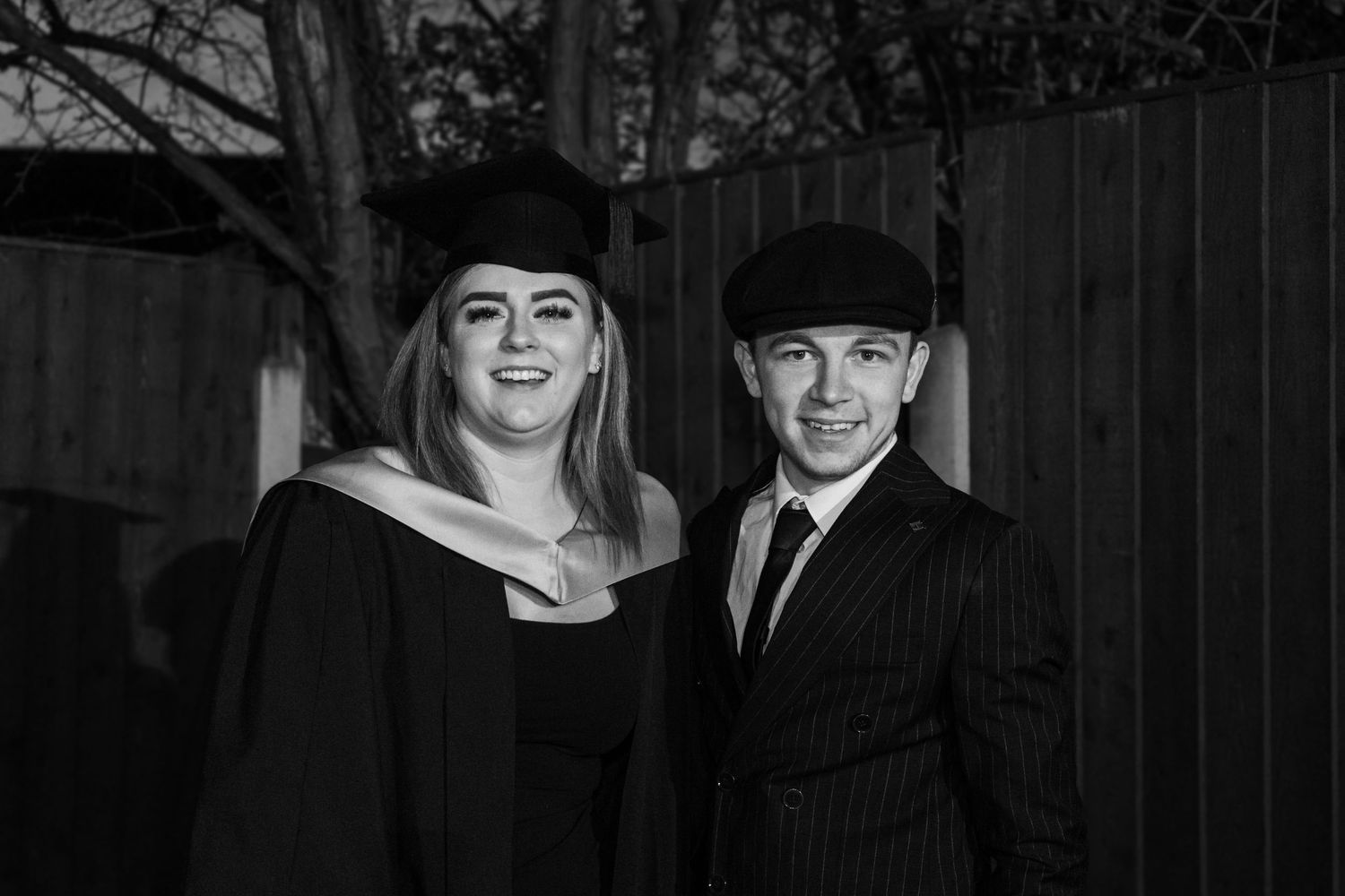 Black and white graduation photos showing joyful celebration moments.