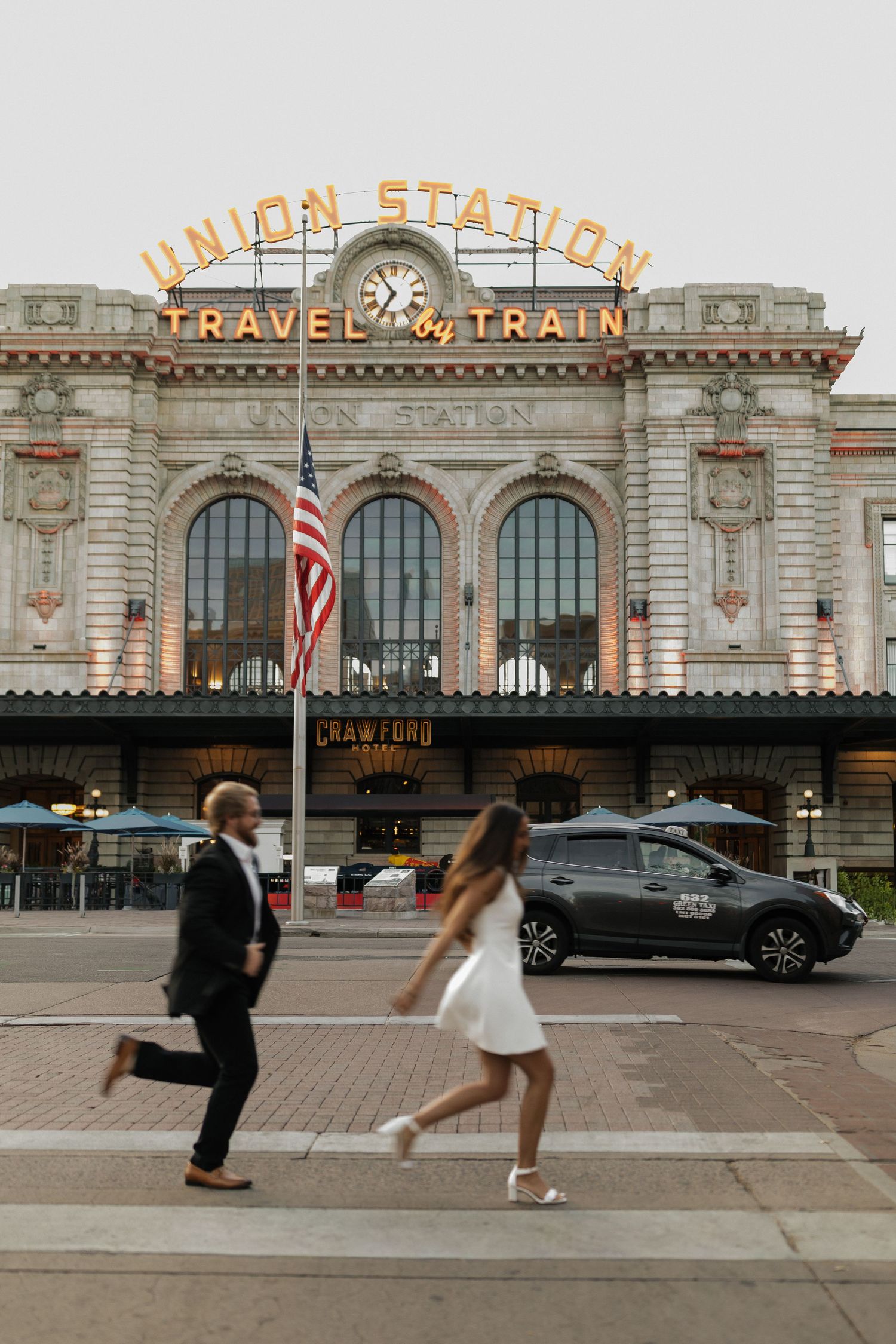 Couple walking together in front of Union Station