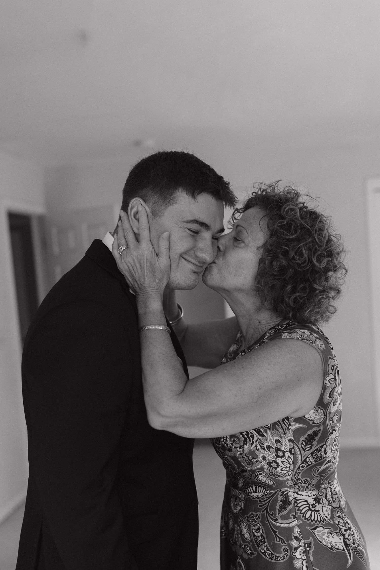 Newlywed couple sharing a kiss during their wedding reception