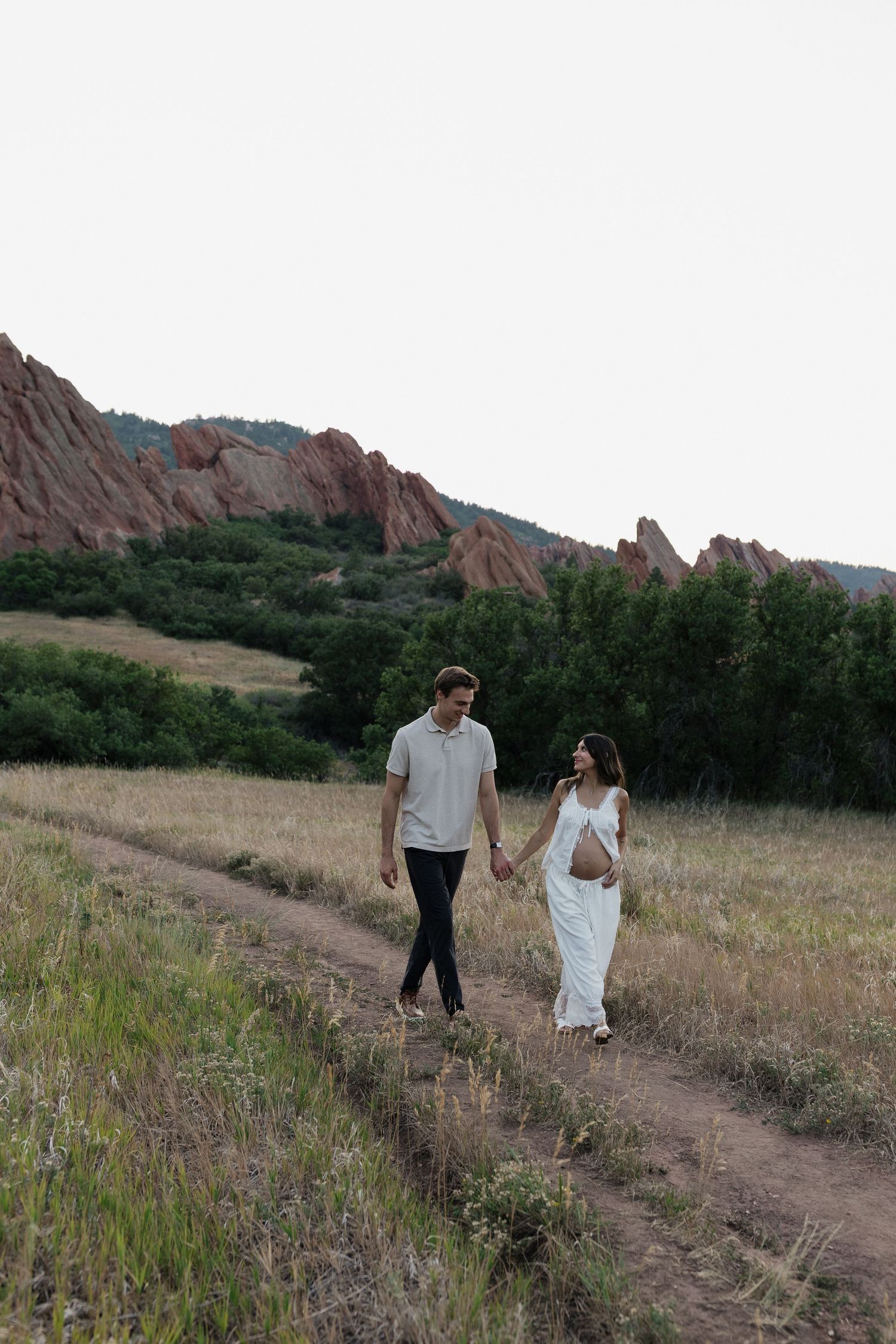 Expecting mother enjoying a peaceful golden hour maternity session in Colorado
