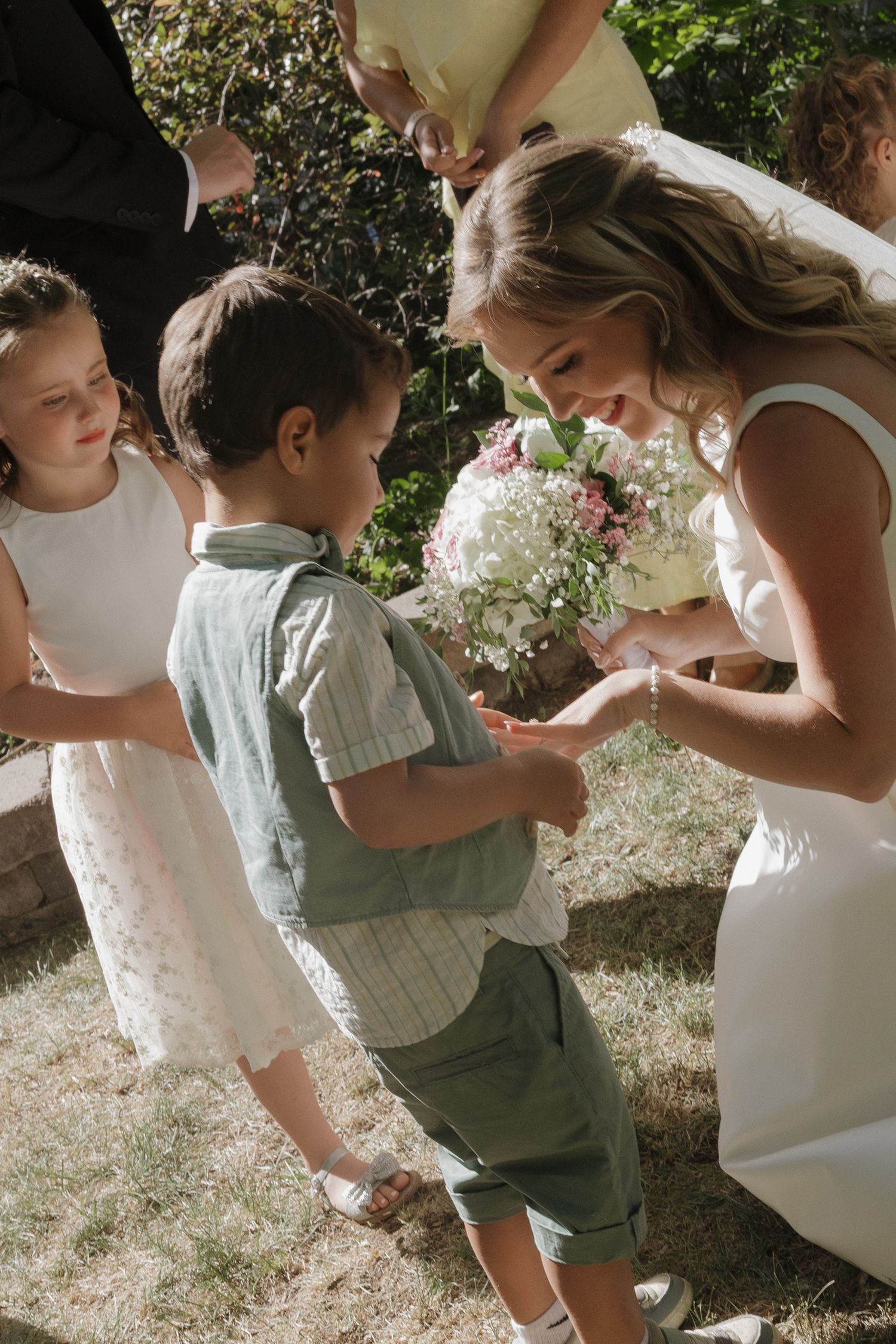 Bride getting ready with her kids before her Colorado wedding
