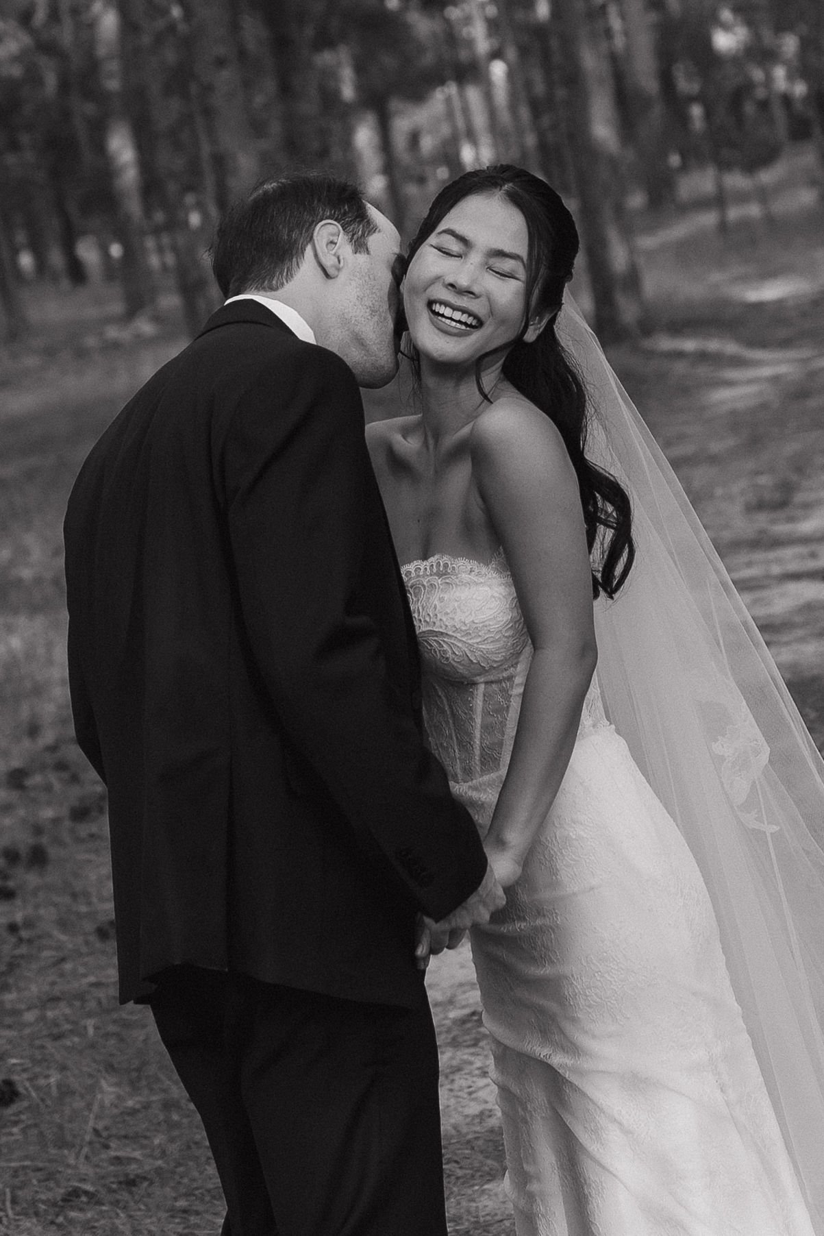 Bride and groom smiling together during their wedding celebration