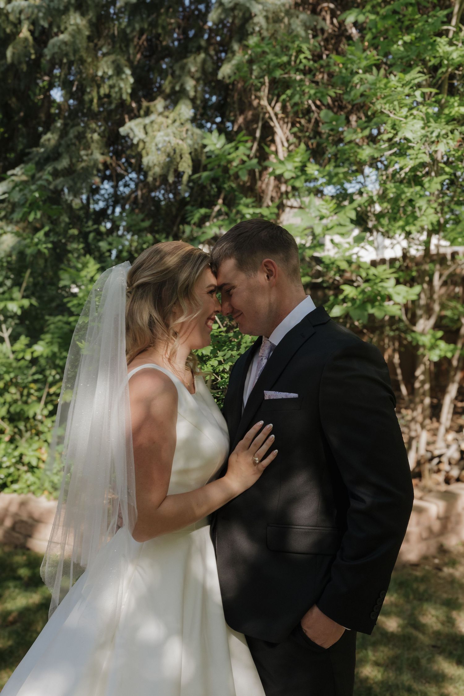 Emotional wedding ceremony moment between bride and groom