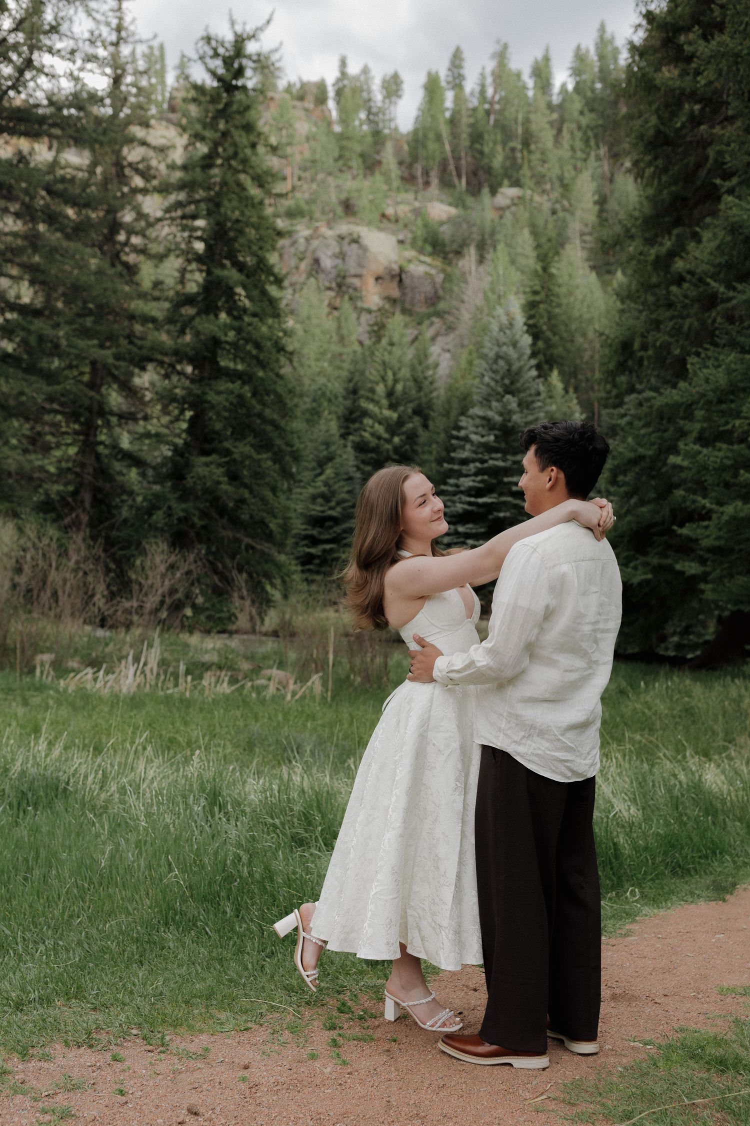 Couple hugging each other in a peaceful forest during a natural couples photography session